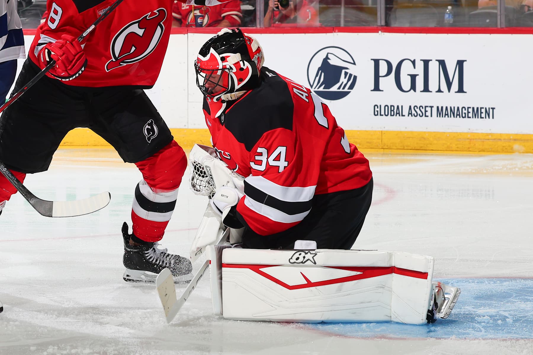 NEWARK, NJ - OCTOBER 22: Jake Allen #34 of the New Jersey Devils defends his net in the second period of the game against the Tampa Bay Lightning at the Prudential Center on October 22, 2024 in Newark, New Jersey. (Photo by Rich Graessle/NHLI via Getty Images)