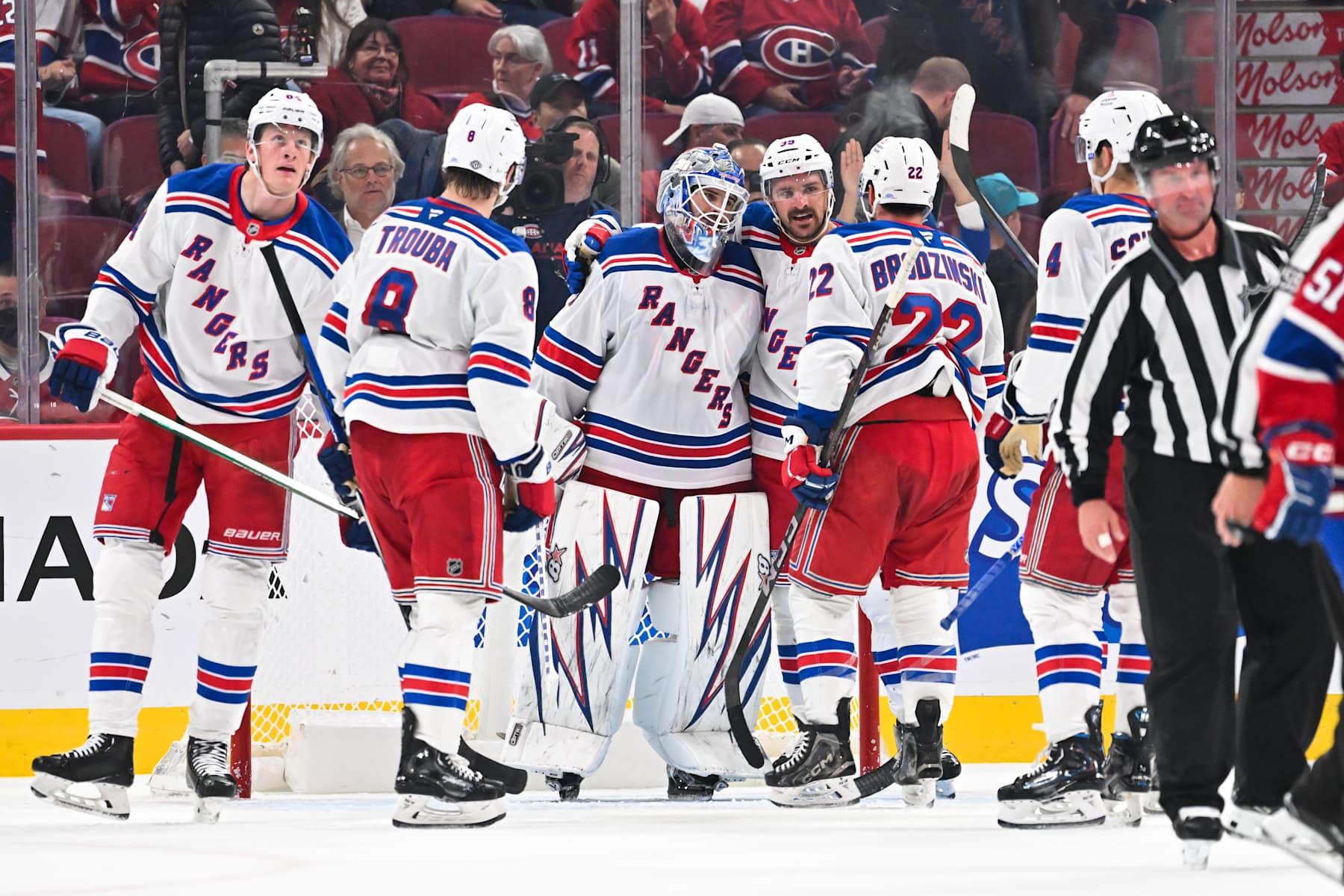 MONTREAL, CANADA - OCTOBER 22: Goaltender Igor Shesterkin #31, Sam Carrick #39, Jacob Trouba #8 and Jonny Brodzinski #22 of the New York Rangers celebrate a victory against the Montreal Canadiens at the Bell Centre on October 22, 2024 in Montreal, Quebec, Canada. The New York Rangers defeated the Montreal Canadiens 7-2. (Photo by Minas Panagiotakis/Getty Images)