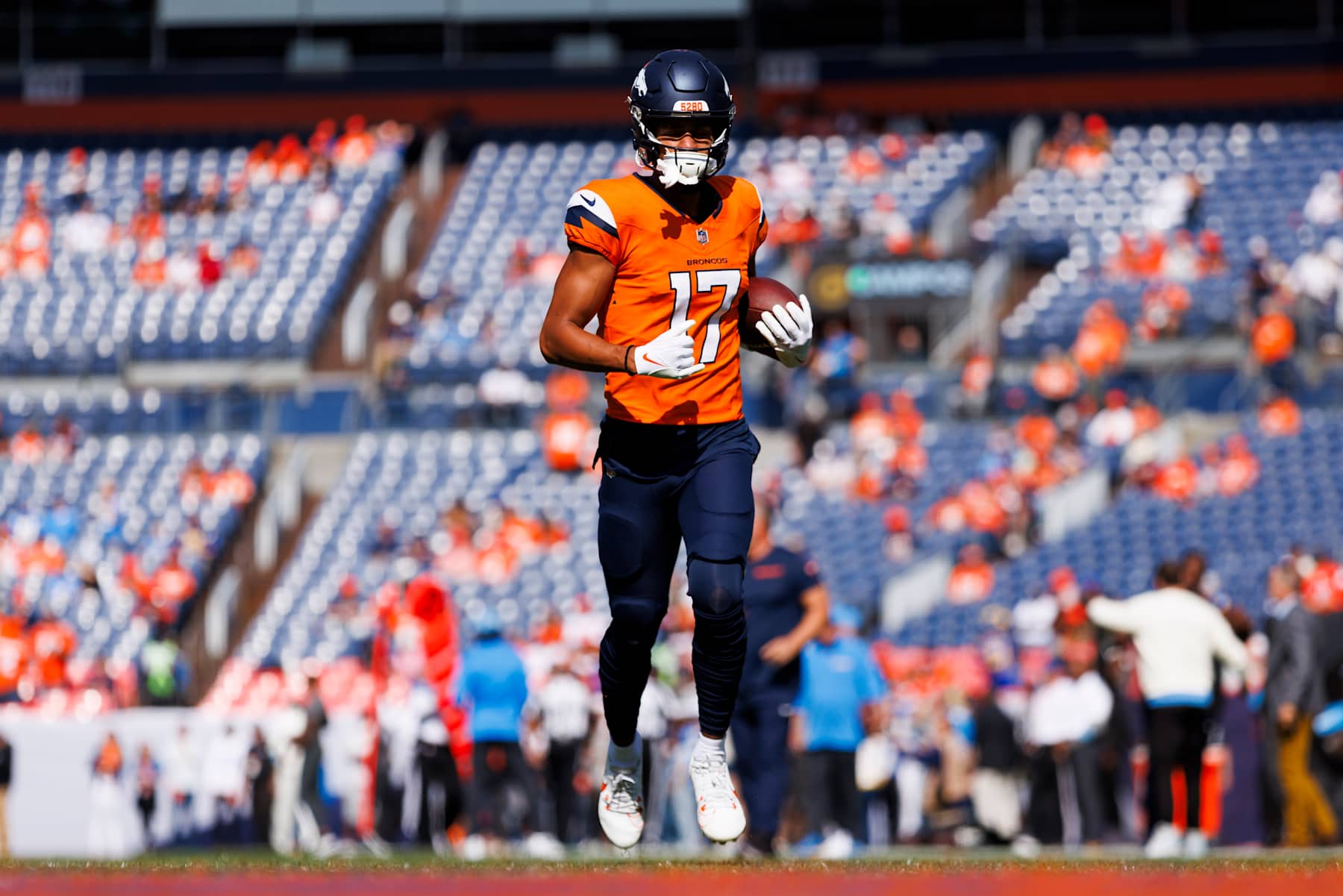 DENVER, COLORADO - OCTOBER 13: Devaughn Vele #17 of the Denver Broncos runs after the catch during the first half against the Los Angeles Chargers at Empower Field At Mile High on October 13, 2024 in Denver, Colorado. (Photo by Ric Tapia/Getty Images)