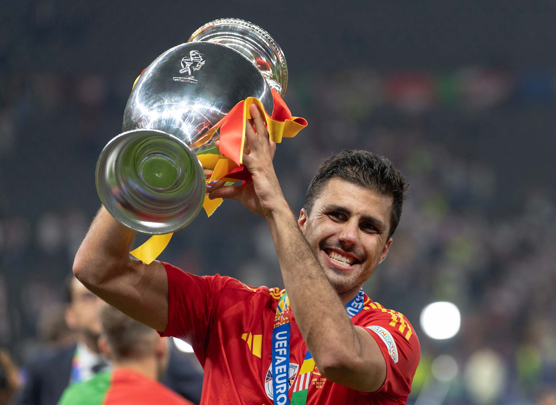 BERLIN, GERMANY - JULY 14: Rodri of Spain with the trophy after the UEFA EURO 2024 final match between Spain and England at Olympiastadion on July 14, 2024 in Berlin, Germany. (Photo by Visionhaus/Getty Images)