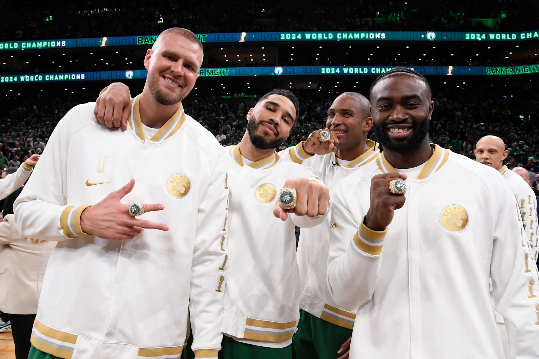 BOSTON, MA - OCTOBER 22: Kristaps Porzingis #8, Al Horford #42, Jayson Tatum #0 and Jaylen Brown #7 of the Boston Celtics pose for a photo with their 2024 Championship rings before the game against the New York Knicks on October 22, 2024 at TD Garden in Boston, Massachusetts. NOTE TO USER: User expressly acknowledges and agrees that, by downloading and/or using this Photograph, user is consenting to the terms and conditions of the Getty Images License Agreement. Mandatory Copyright Notice: Copyright 2024 NBAE (Photo by Brian Babineau/NBAE via Getty Images)