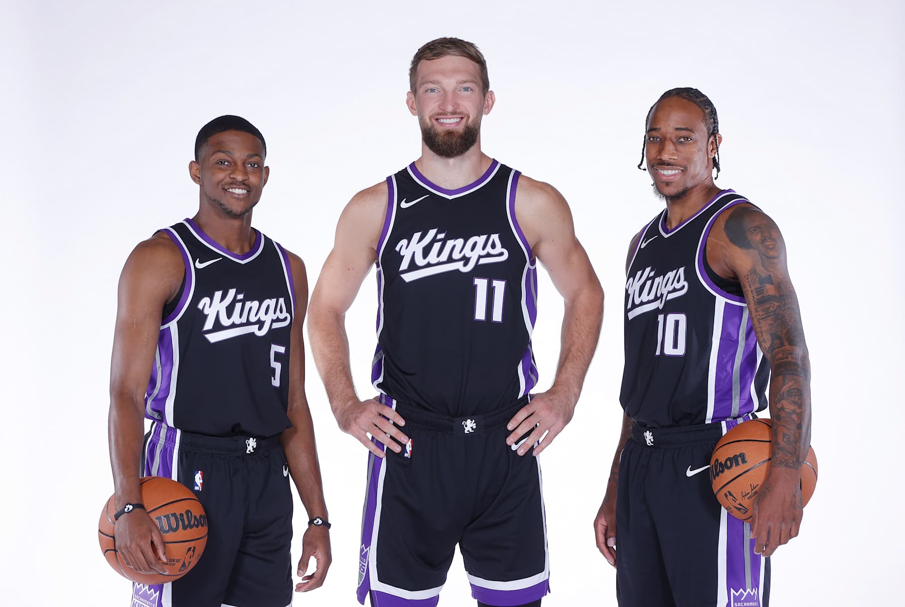 SACRAMENTO, CA - SEPTEMBER 30: De'Aaron Fox #5, Domantas Sabonis #11 and DeMar DeRozan #10 of the Sacramento Kings poses for a portrait during NBA Media Day on September 30, 2024 at the Golden 1 Center in Sacramento, California. NOTE TO USER: User expressly acknowledges and agrees that, by downloading and/or using this Photograph, user is consenting to the terms and conditions of the Getty Images License Agreement. Mandatory Copyright Notice: Copyright 2024 NBAE (Photo by Rocky Widner/NBAE via Getty Images)