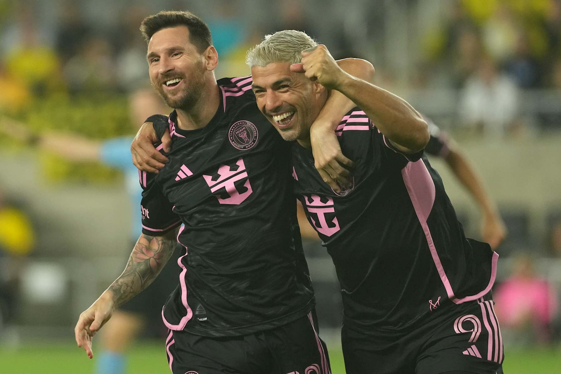 COLUMBUS, OHIO - OCTOBER 02: Lionel Messi #10 and Luis Suarez #9 of Inter Miami CF celebrate a goal in the second half against the Columbus Crew at Lower.com Field on October 02, 2024 in Columbus, Ohio. (Photo by Jason Mowry/Getty Images)