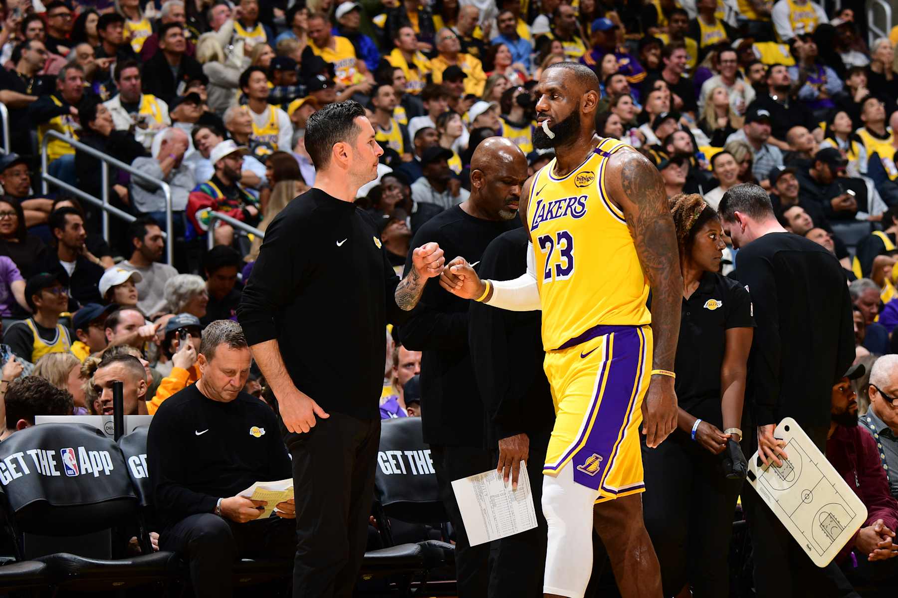 LOS ANGELES, CA - OCTOBER 22: Head Coach JJ Redick of the Los Angeles Lakers fist bumps LeBron James #23 of the Los Angeles Lakers during the game against the Minnesota Timberwolves on October 22, 2024 at Crypto.Com Arena in Los Angeles, California. NOTE TO USER: User expressly acknowledges and agrees that, by downloading and/or using this Photograph, user is consenting to the terms and conditions of the Getty Images License Agreement. Mandatory Copyright Notice: Copyright 2024 NBAE (Photo by Adam Pantozzi/NBAE via Getty Images)