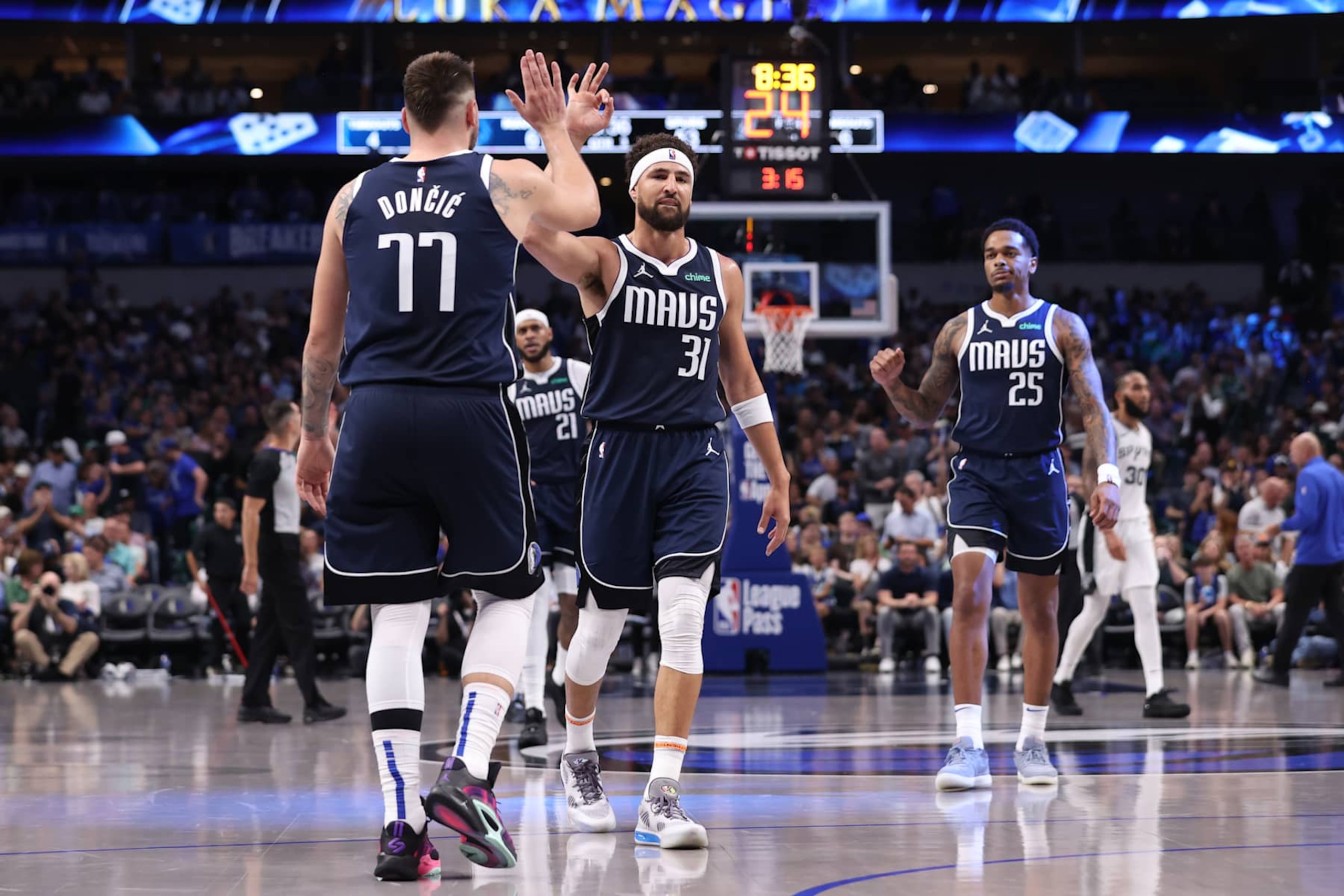 DALLAS, TX - OCTOBER 24: Luka Doncic #77 and Klay Thompson #31 of the Dallas Mavericks high five during the game against the San Antonio Spurs on October 24, 2024 at American Airlines Center in Dallas, Texas. NOTE TO USER: User expressly acknowledges and agrees that, by downloading and or using this photograph, User is consenting to the terms and conditions of the Getty Images License Agreement. Mandatory Copyright Notice: Copyright 2024 NBAE (Photo by Joe Murphy/NBAE via Getty Images)