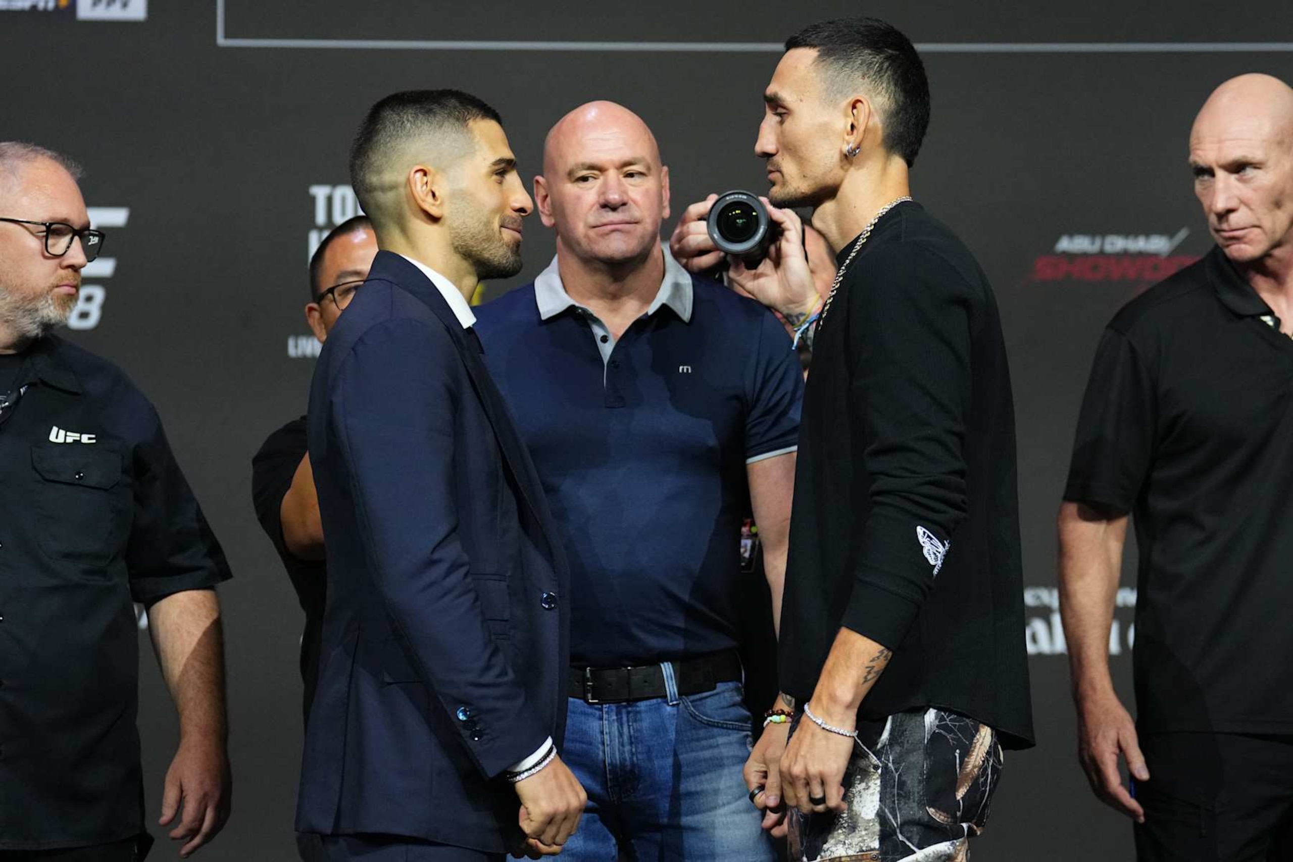 Opponents Ilia Topuria and Max Holloway face off