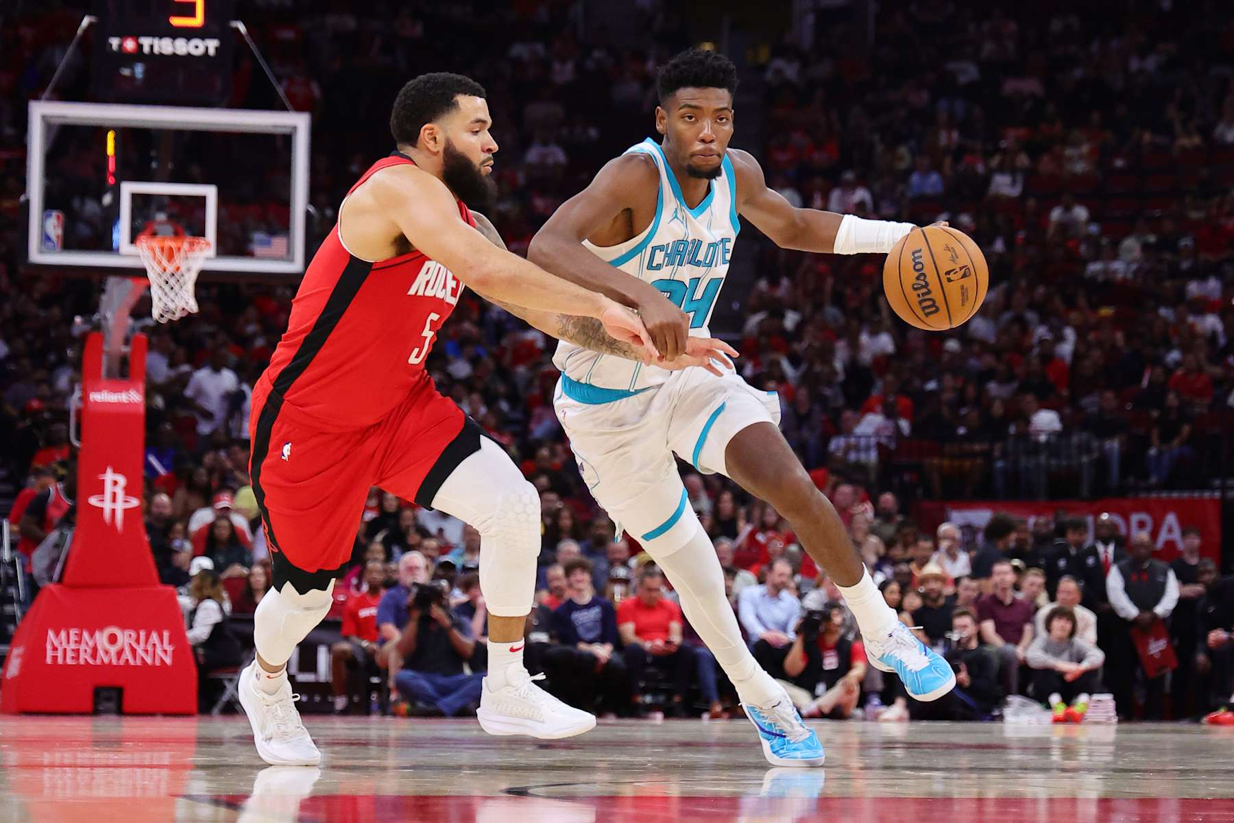 HOUSTON, TEXAS - OCTOBER 23: Brandon Miller #24 of the Charlotte Hornets dribbles against Fred VanVleet #5 of the Houston Rockets during the first half at Toyota Center on October 23, 2024 in Houston, Texas.  NOTE TO USER: User expressly acknowledges and agrees that, by downloading and or using this photograph, User is consenting to the terms and conditions of the Getty Images License Agreement. (Photo by Alex Slitz/Getty Images)