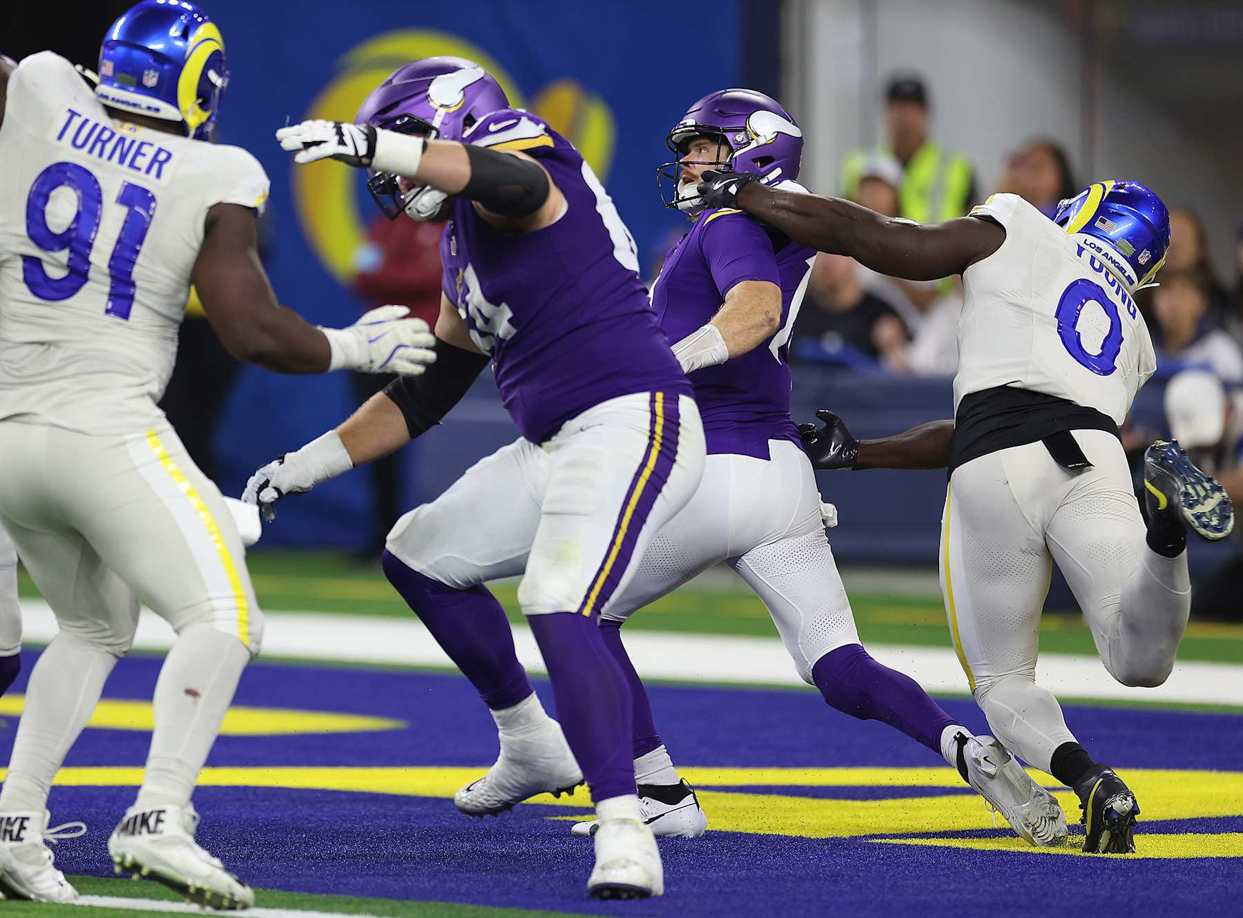 INGLEWOOD, CALIFORNIA - OCTOBER 24: Byron Young #0 of the Los Angeles Rams makes the tackle against Sam Darnold #14 of the Minnesota Vikings for a safety in the fourth quarter at SoFi Stadium on October 24, 2024 in Inglewood, California. (Photo by Harry How/Getty Images)