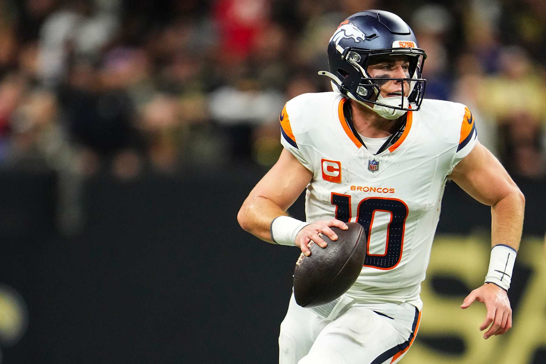 NEW ORLEANS, LA - OCTOBER 17: Bo Nix #10 of the Denver Broncos scrambles out of the pocket during an NFL football game against the New Orleans Saints at Caesars Superdome on October 17, 2024 in New Orleans, Louisiana. (Photo by Cooper Neill/Getty Images)