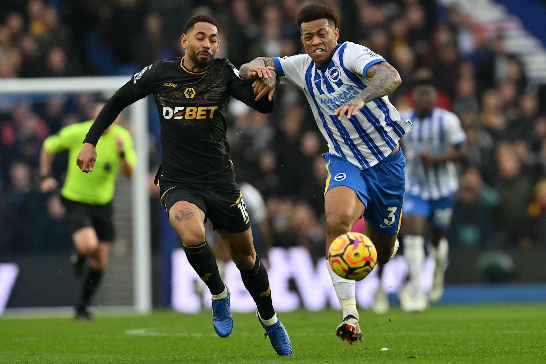 Wolverhampton Wanderers' Brazilian striker #10 Matheus Cunha (L) vies with Brighton's Brazilian defender #03 Igor Julio (R) during the English Premier League football match between Brighton and Hove Albion and Wolverhampton Wanderers at the American Express Community Stadium in Brighton, southern England, on October 26, 2024. (Photo by Glyn KIRK / AFP) / RESTRICTED TO EDITORIAL USE. No use with unauthorized audio, video, data, fixture lists, club/league logos or 'live' services. Online in-match use limited to 120 images. An additional 40 images may be used in extra time. No video emulation. Social media in-match use limited to 120 images. An additional 40 images may be used in extra time. No use in betting publications, games or single club/league/player publications. / (Photo by GLYN KIRK/AFP via Getty Images)