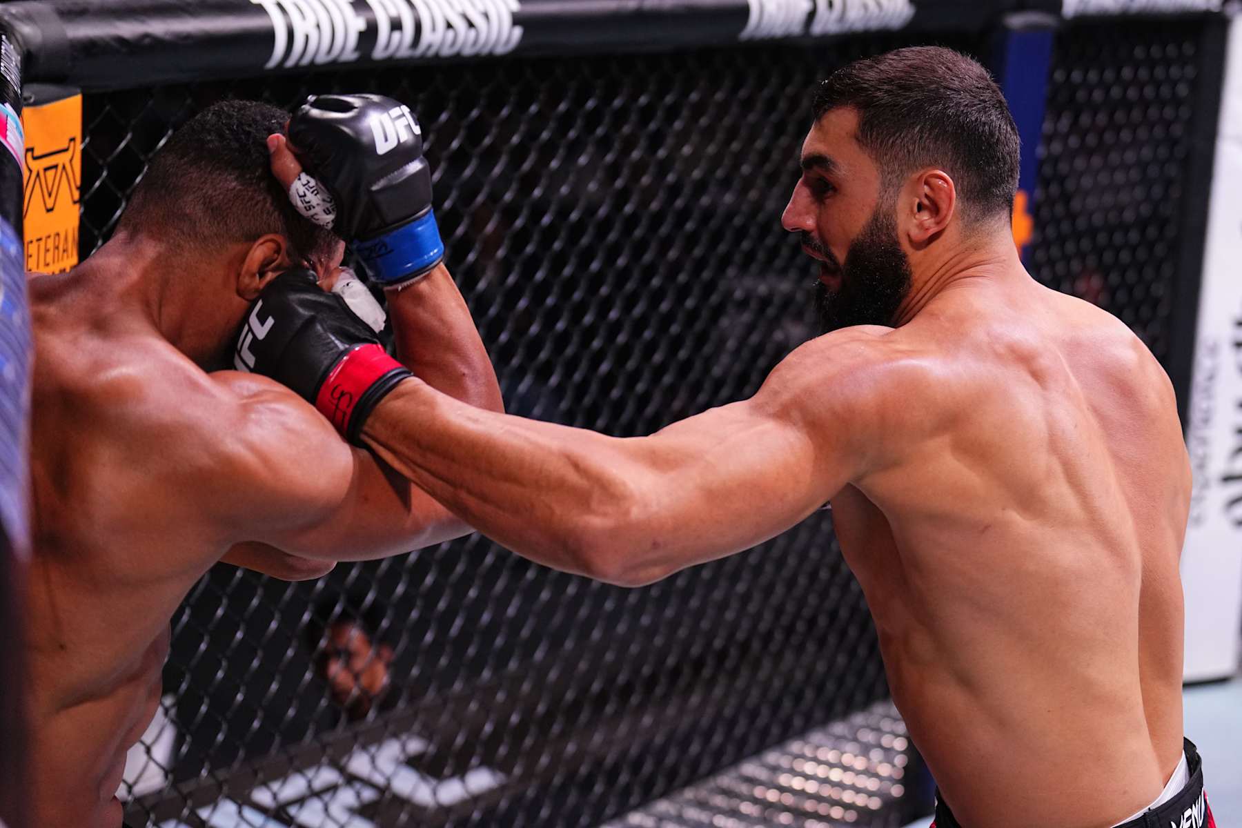 ABU DHABI, UNITED ARAB EMIRATES - OCTOBER 26: (R-L) Ibo Aslan of Turkey punches Rafael Cerqueira of Brazil in a light heavyweight fight during the UFC 308 event at Etihad Arena on October 26, 2024 in Abu Dhabi, United Arab Emirates. (Photo by Chris Unger/Zuffa LLC)