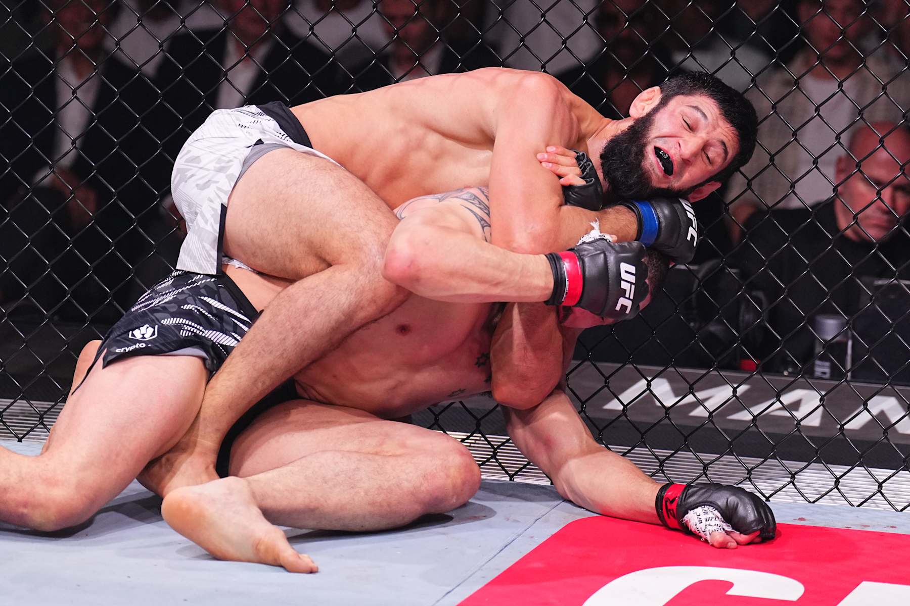 ABU DHABI, UNITED ARAB EMIRATES - OCTOBER 26: (L-R) Khamzat Chimaev of Russia secures a submission against \rw in a middleweight fight during the UFC 308 event at Etihad Arena on October 26, 2024 in Abu Dhabi, United Arab Emirates. (Photo by Chris Unger/Zuffa LLC)