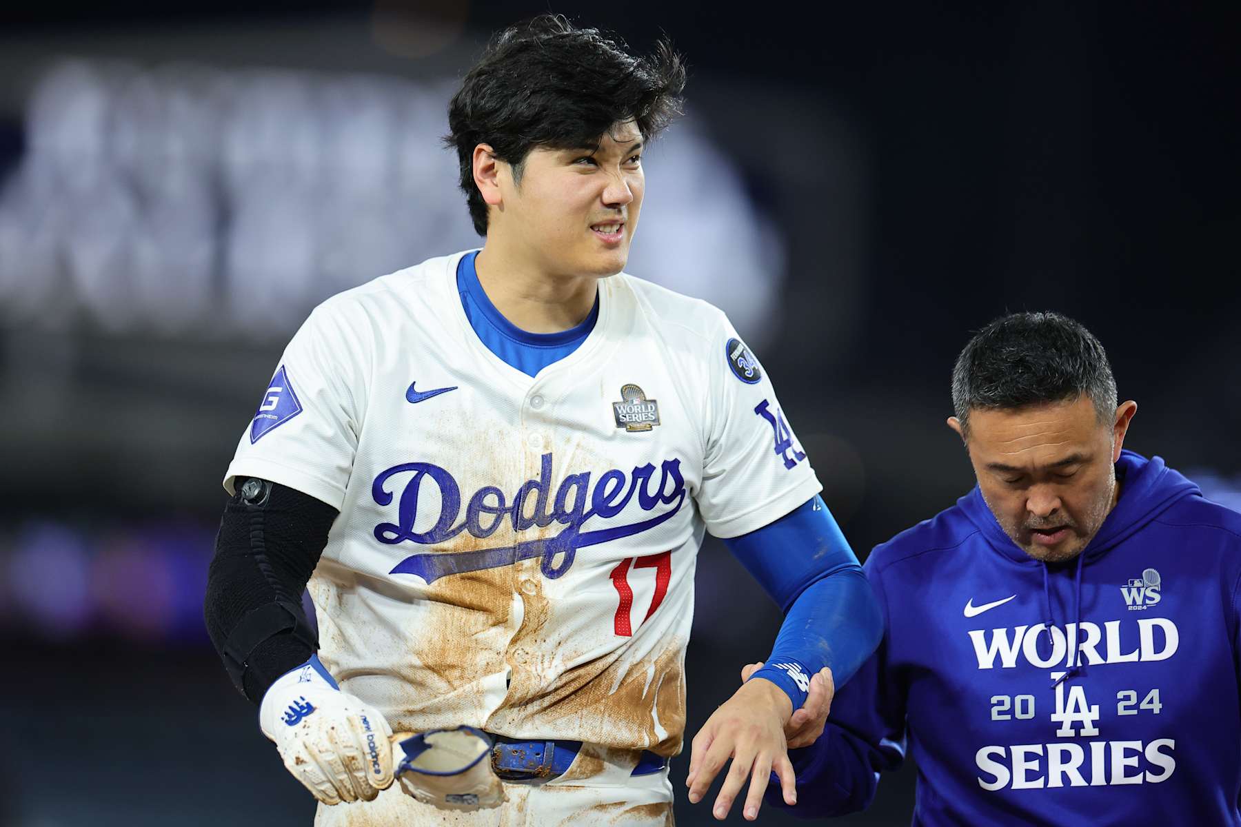 LOS ANGELES, CALIFORNIA - OCTOBER 26: Shohei Ohtani #17 of the Los Angeles Dodgers walks off the field after injuring his arm while attempting to steal second base as they play against the New York Yankees in the seventh inning during Game Two of the 2024 World Series at Dodger Stadium on October 26, 2024 in Los Angeles, California. (Photo by Alex Slitz/Getty Images)