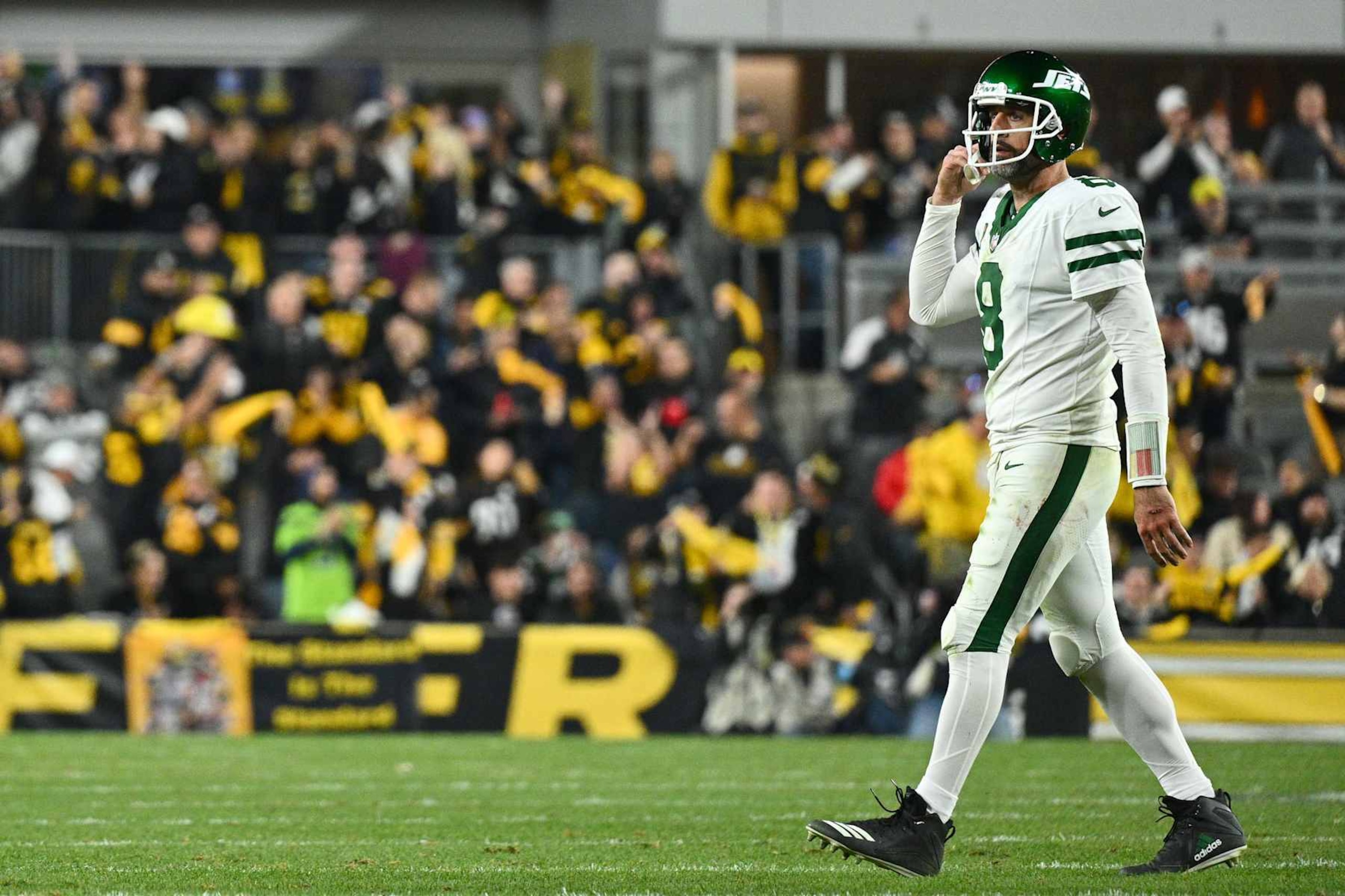 PITTSBURGH, PENNSYLVANIA - OCTOBER 20: Aaron Rodgers #8 of the New York Jets walks onto the field during the fourth quarter against the Pittsburgh Steelers at Acrisure Stadium on October 20, 2024 in Pittsburgh, Pennsylvania. (Photo by Justin Berl/Getty Images)
