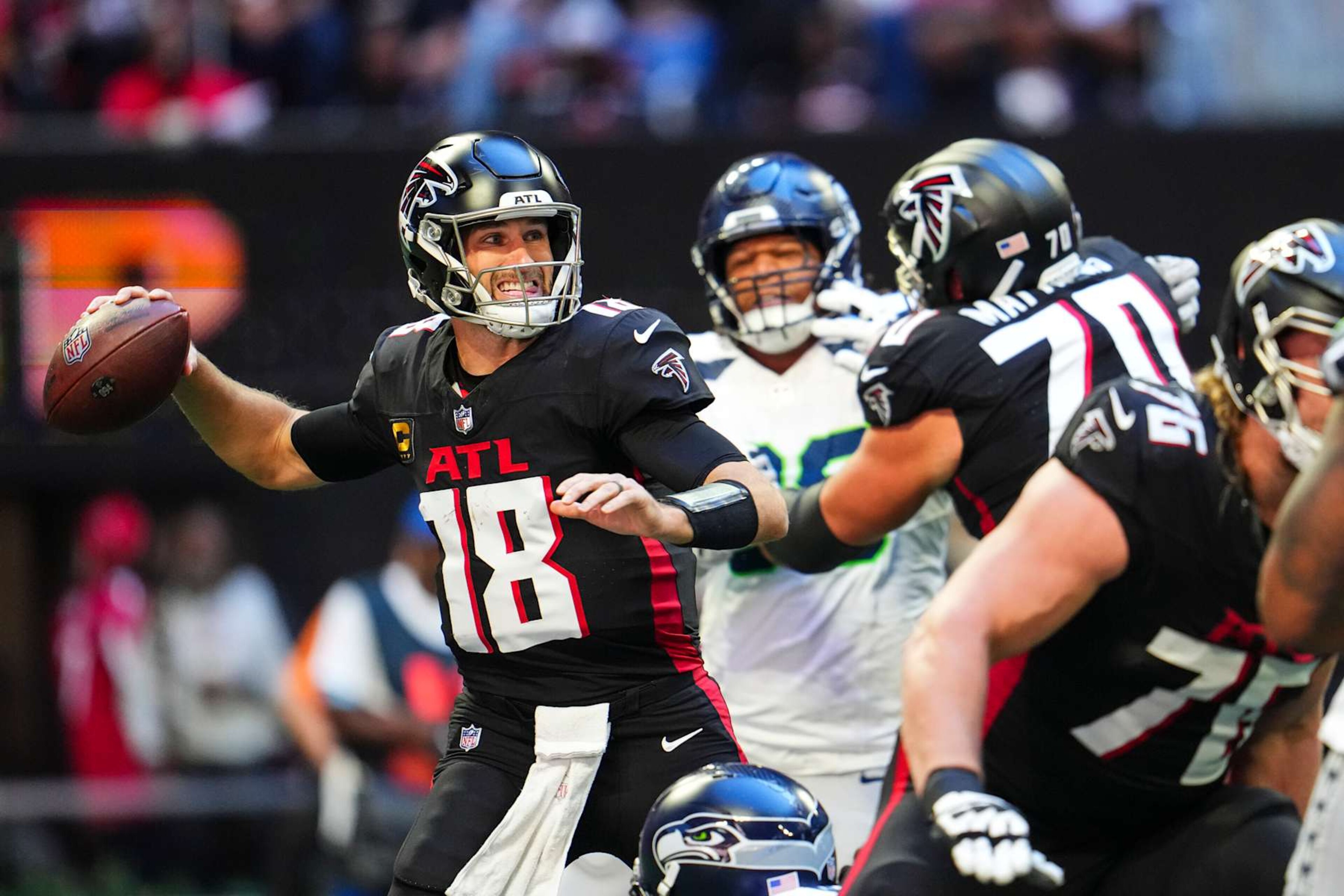 ATLANTA, GA - OCTOBER 20: Kirk Cousins #18 of the Atlanta Falcons throws the ball during an NFL football game against the Seattle Seahawks at Mercedes-Benz Stadium on October 20, 2024 in Atlanta, Georgia. (Photo by Cooper Neill/Getty Images) ATLANTA, GA - OCTOBER 20: Kirk Cousins #18 of the Atlanta Falcons throws the ball during an NFL football game against the Seattle Seahawks at Mercedes-Benz Stadium on October 20, 2024 in Atlanta, Georgia. (Photo by Cooper Neill/Getty Images)