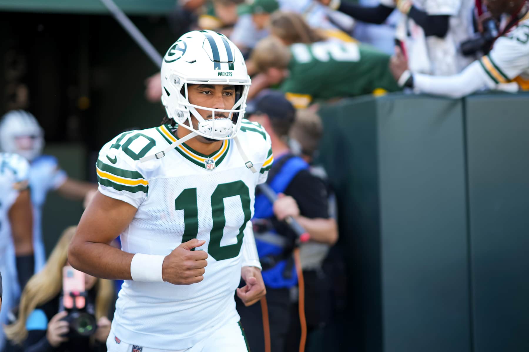 GREEN BAY, WISCONSIN  - OCTOBER 20: Quarterback Jordan Love #10 of the Green Bay Packers enters the field prior to an NFL football game against the Houston Texans, at Lambeau Field on October 20, 2024 in Green Bay, Wisconsin. (Photo by Todd Rosenberg/Getty Images)