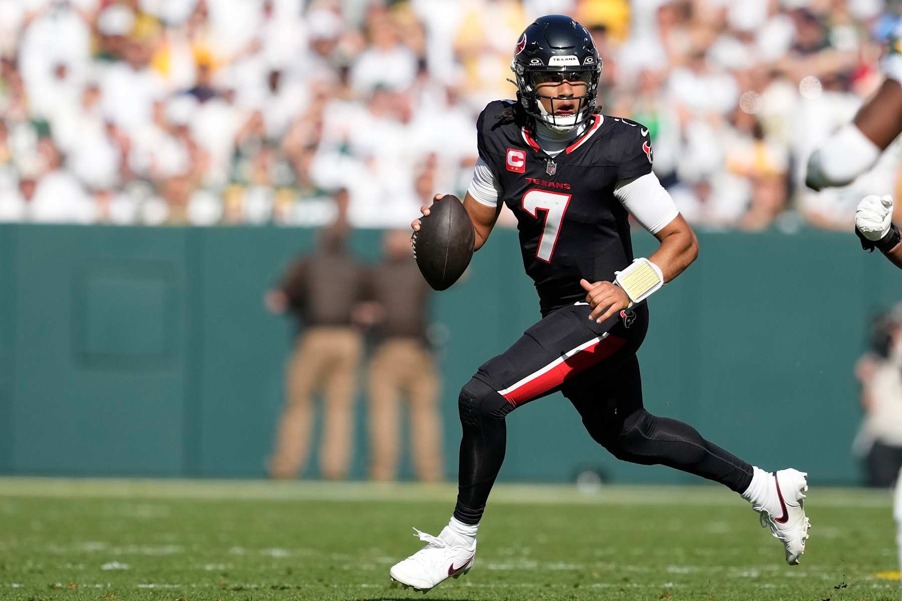 GREEN BAY, WISCONSIN - OCTOBER 20: C.J. Stroud #7 of the Houston Texans looks to throw a pass against the Green Bay Packers in the first half during a game at Lambeau Field on October 20, 2024 in Green Bay, Wisconsin. (Photo by Patrick McDermott/Getty Images)
