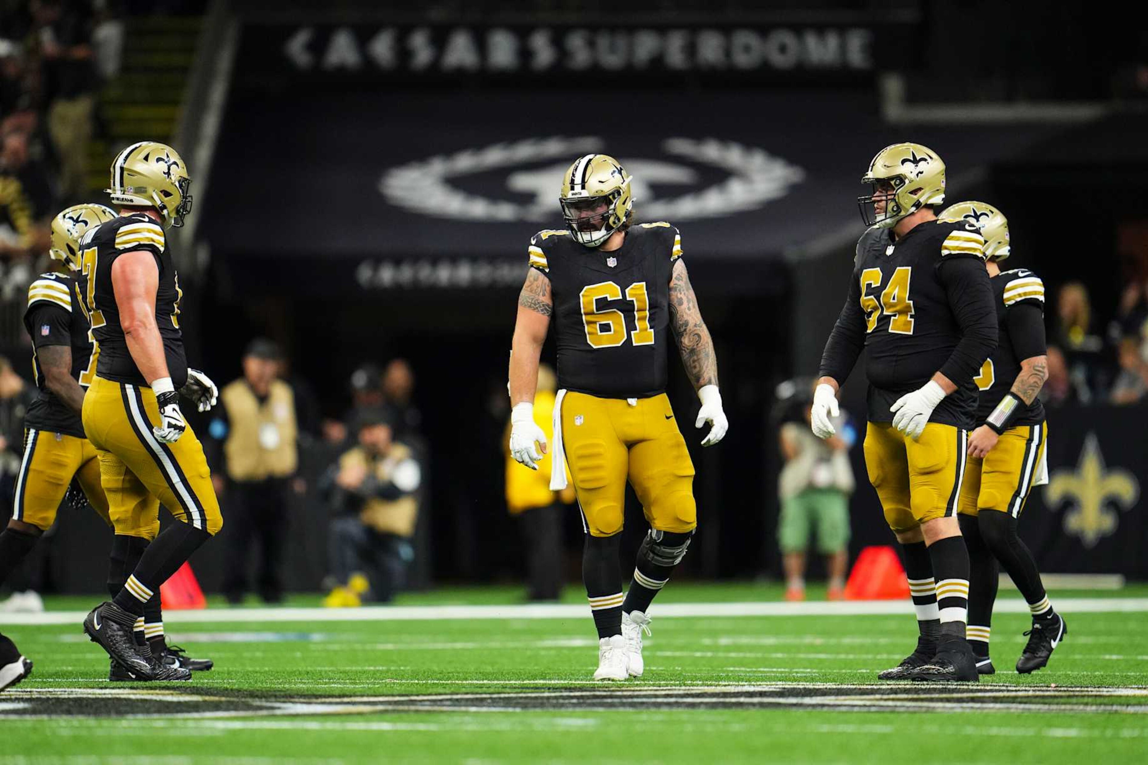 NEW ORLEANS, LA - OCTOBER 17: Connor McGovern #61 of the New Orleans Saints lines up before the snap during an NFL football game against the Denver Broncos at Caesars Superdome on October 17, 2024 in New Orleans, Louisiana. (Photo by Cooper Neill/Getty Images) NEW ORLEANS, LA - OCTOBER 17: Connor McGovern #61 of the New Orleans Saints lines up before the snap during an NFL football game against the Denver Broncos at Caesars Superdome on October 17, 2024 in New Orleans, Louisiana. (Photo by Cooper Neill/Getty Images)