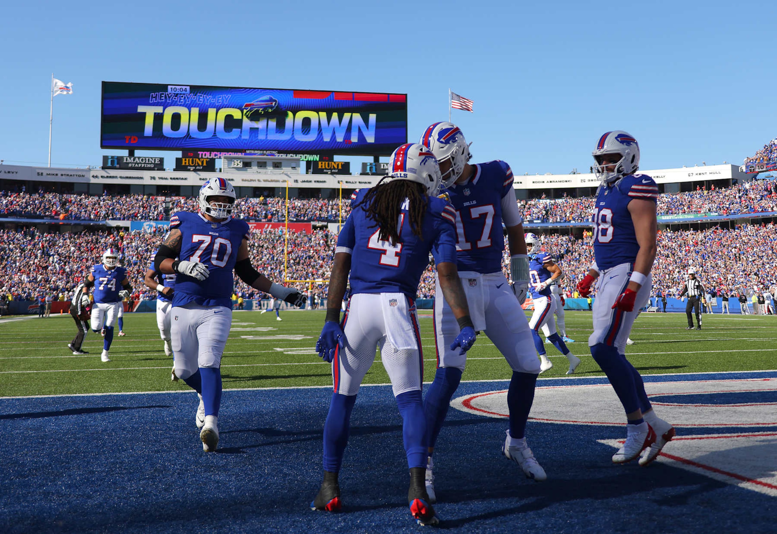 ORCHARD PARK, NEW YORK - OCTOBER 20: James Cook #4 of the Buffalo Bills celebrates scoring a touchdown with teammate Josh Allen #17 during the second quarter against the Tennessee Titans at Highmark Stadium on October 20, 2024 in Orchard Park, New York. (Photo by Timothy T Ludwig/Getty Images)