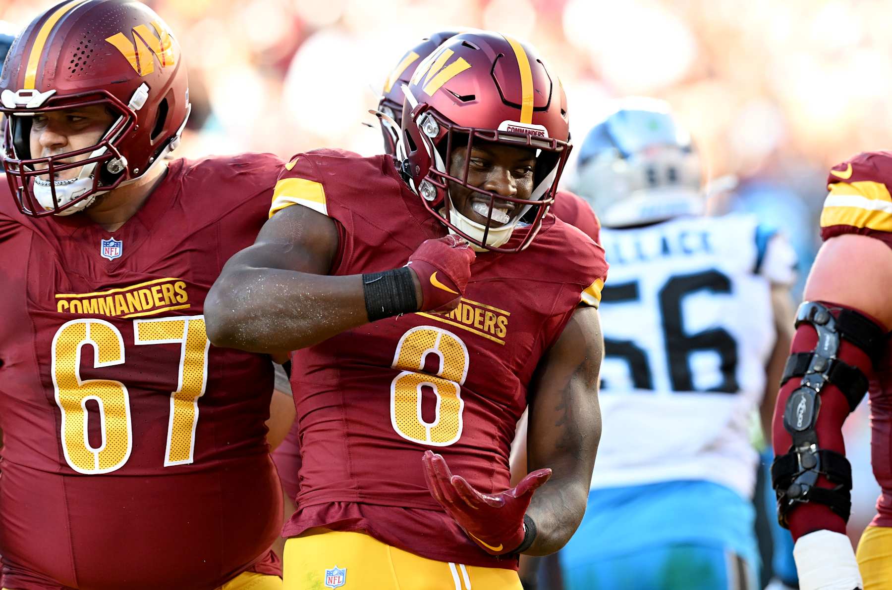 LANDOVER, MARYLAND - OCTOBER 20: Brian Robinson Jr. #8 of the Washington Commanders celebrates after scoring a touchdown against the Carolina Panthers at Northwest Stadium on October 20, 2024 in Landover, Maryland. (Photo by G Fiume/Getty Images)