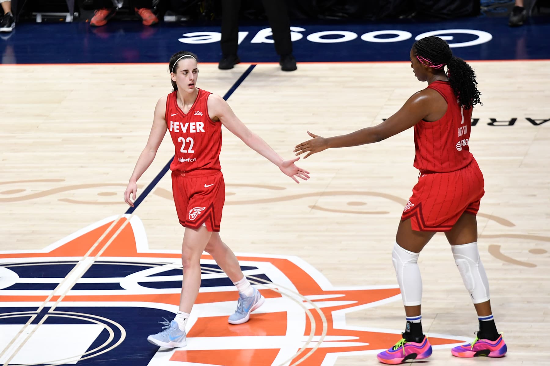 UNCASVILLE, CT - SEPTEMBER 25: Indiana Fever guard Caitlin Clark (22) and Indiana Fever forward Aliyah Boston (7) high five during game 2 of the first round of the WNBA Playoffs between the Indiana Fever and the Connecticut Sun on September 25, 2024, at Mohegan Sun Arena in Uncasville, CT. (Photo by Joseph Denhoff/Icon Sportswire via Getty Images)