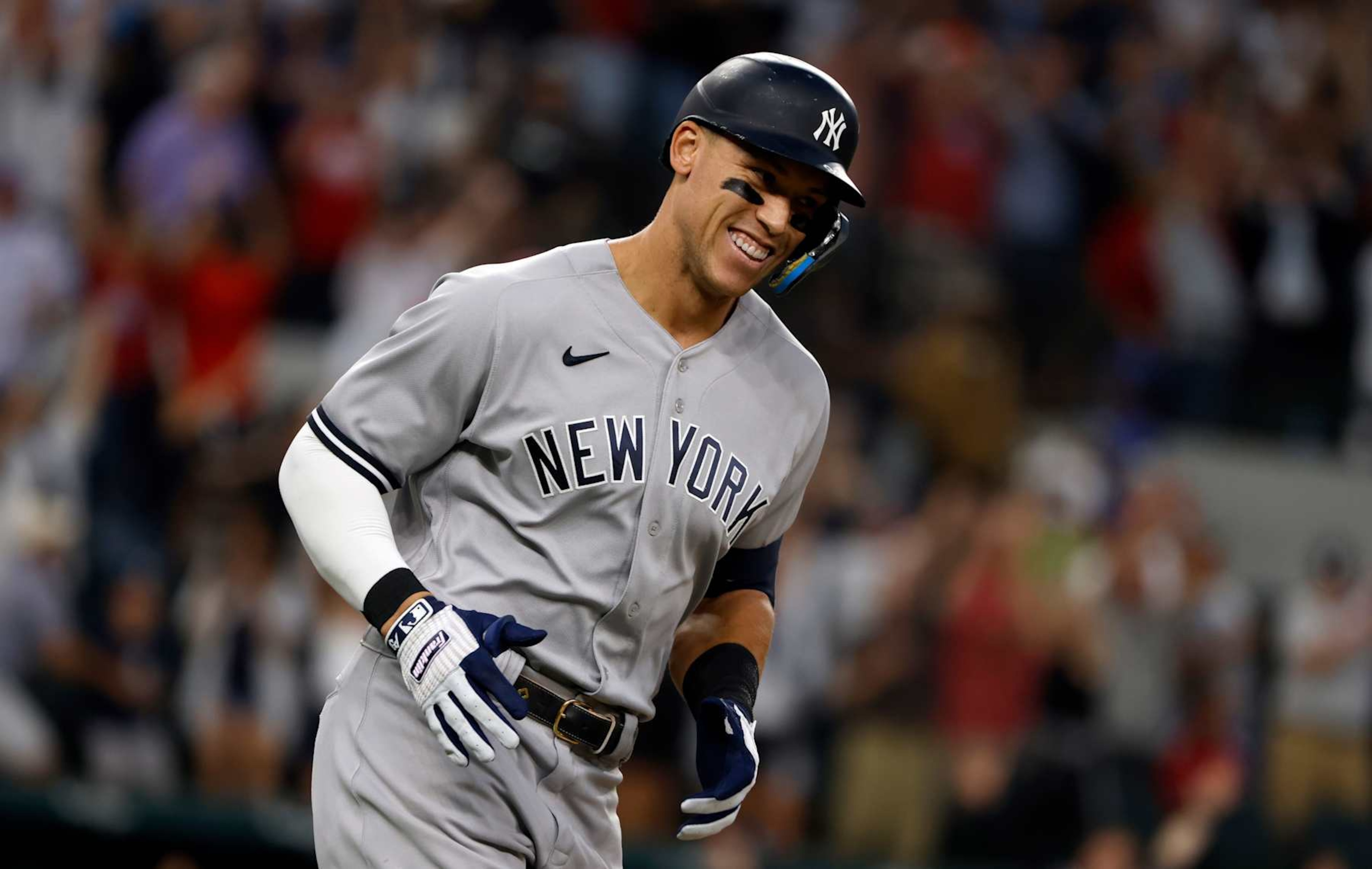 ARLINGTON, TX - OCTOBER 4:
Aaron Judge #99 of the New York Yankees rounds the bases after hitting his 62nd home run of the season against the Texas Rangers during the first inning in game two of a double header at Globe Life Field on October 4, 2022 in Arlington, Texas. Judge has now set the American League record for home runs in a single season. (Photo by Ron Jenkins/Getty Images) ARLINGTON, TX - OCTOBER 4:
Aaron Judge #99 of the New York Yankees rounds the bases after hitting his 62nd home run of the season against the Texas Rangers during the first inning in game two of a double header at Globe Life Field on October 4, 2022 in Arlington, Texas. Judge has now set the American League record for home runs in a single season. (Photo by Ron Jenkins/Getty Images)