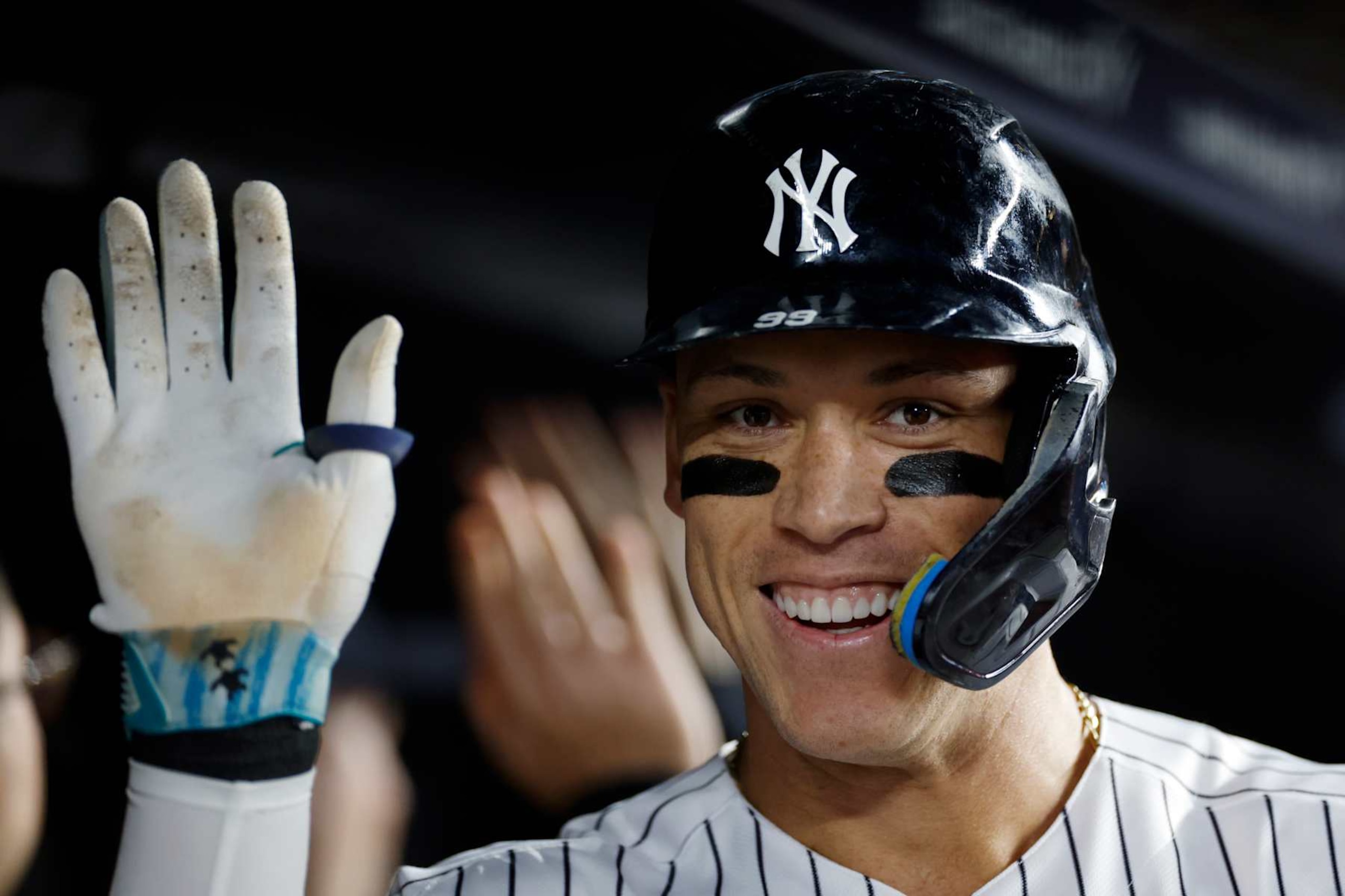 NEW YORK, NEW YORK - SEPTEMBER 22: Aaron Judge #99 of the New York Yankees celebrates in the dugout after hitting a two-run home run during the fifth inning of the game against the Arizona Diamondbacks at Yankee Stadium on September 22, 2023 in the Bronx borough of New York City. (Photo by Sarah Stier/Getty Images)