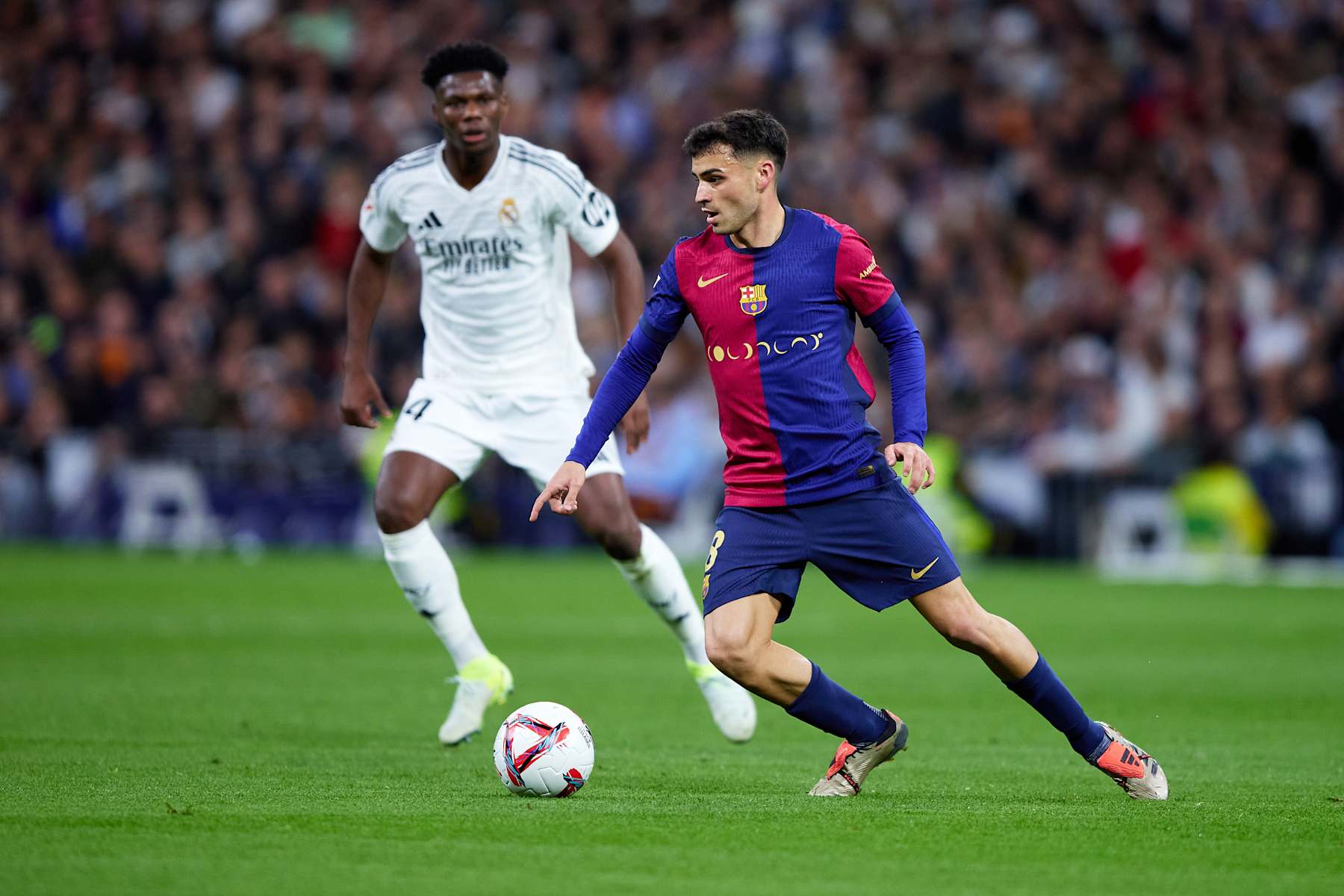 MADRID, SPAIN - OCTOBER 26: Pedro Gonzalez Lopez 'Pedri' of FC Barcelona runs with the ball during the LaLiga match between Real Madrid CF and FC Barcelona at Estadio Santiago Bernabeu on October 26, 2024 in Madrid, Spain. (Photo by Alvaro Medranda/Quality Sport Images/Getty Images)