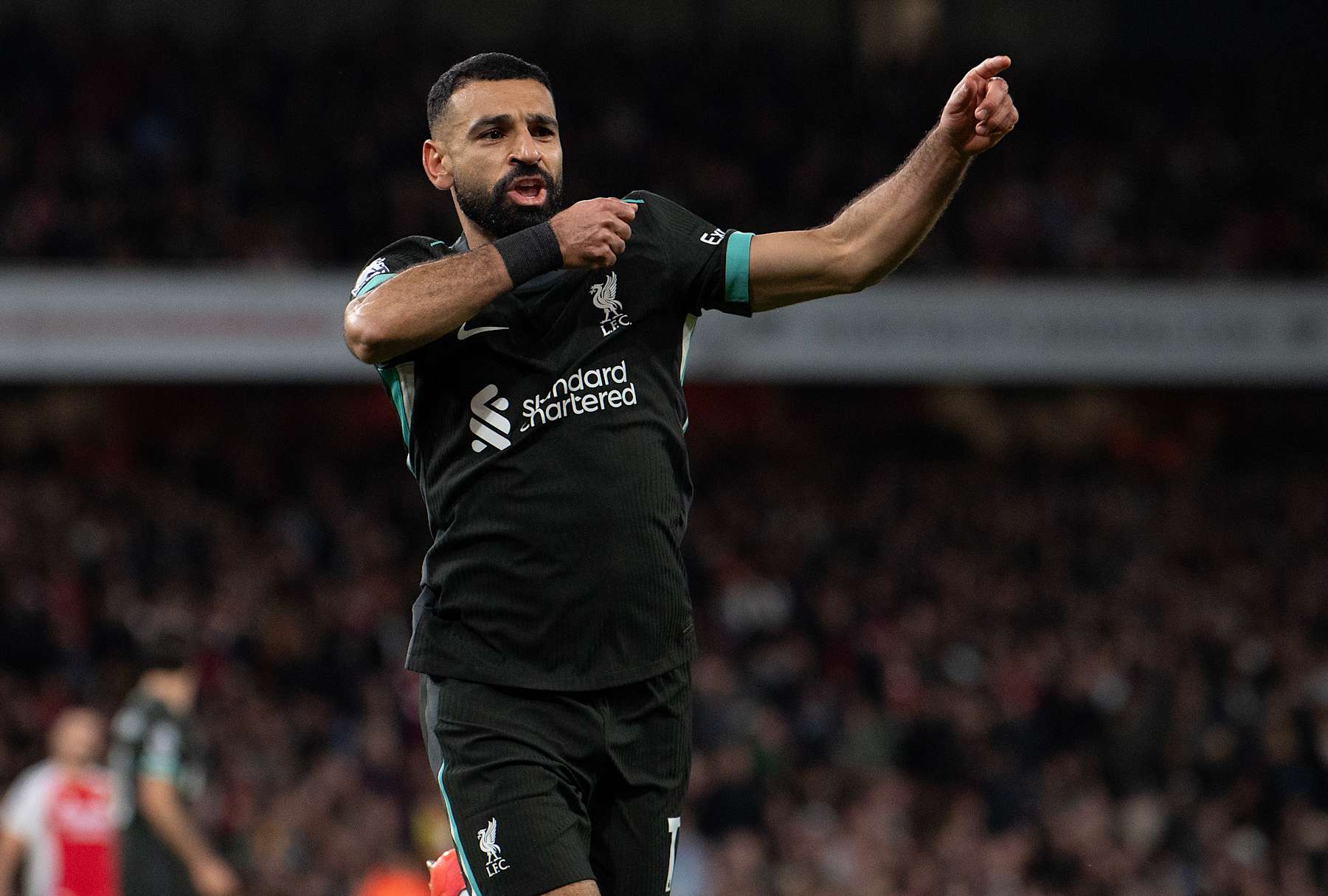 LONDON, ENGLAND - OCTOBER 27: Mohamed Salah celebrates his late equaliser for Liverpool during the Premier League match between Arsenal FC and Liverpool FC at Emirates Stadium on October 27, 2024 in London, England. (Photo by Visionhaus/Getty Images)