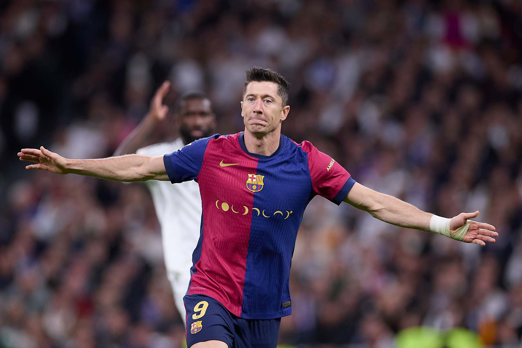 MADRID, SPAIN - 2024/10/26: Robert Lewandowski of FC Barcelona celebrates a goal during the 2024/2025 La Liga EA Sports week 11 football match between Real Madrid CF and FC Barcelona at Santiago Bernabeu stadium. Final score: Real Madrid CF 0 : 4 FC Barcelona. (Photo by Federico Titone/SOPA Images/LightRocket via Getty Images)