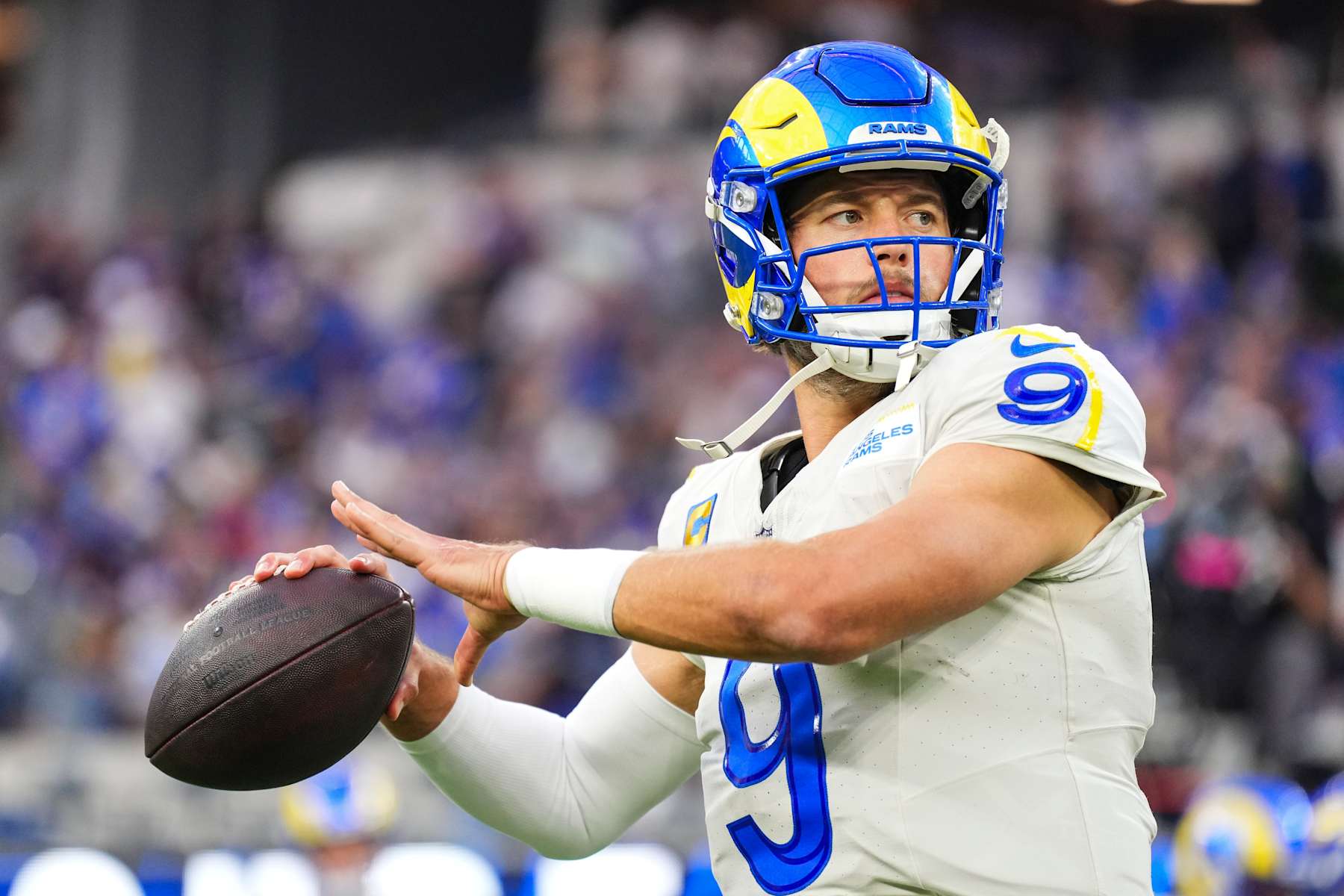 INGLEWOOD, CA - OCTOBER 24: Matthew Stafford #9 of the Los Angeles Rams warms up prior to an NFL football game against the Minnesota Vikings at SoFi Stadium on October 24, 2024 in Inglewood, California. (Photo by Cooper Neill/Getty Images)