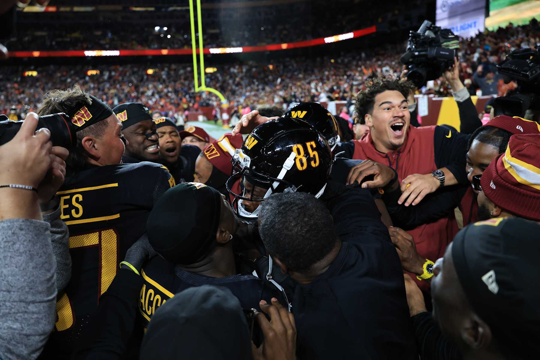 LANDOVER, MARYLAND - OCTOBER 27: Noah Brown #85 of the Washington Commanders celebrates his game winning touchdown reception against the Chicago Bears at Northwest Stadium on October 27, 2024 in Landover, Maryland. (Photo by Scott Taetsch/Getty Images)