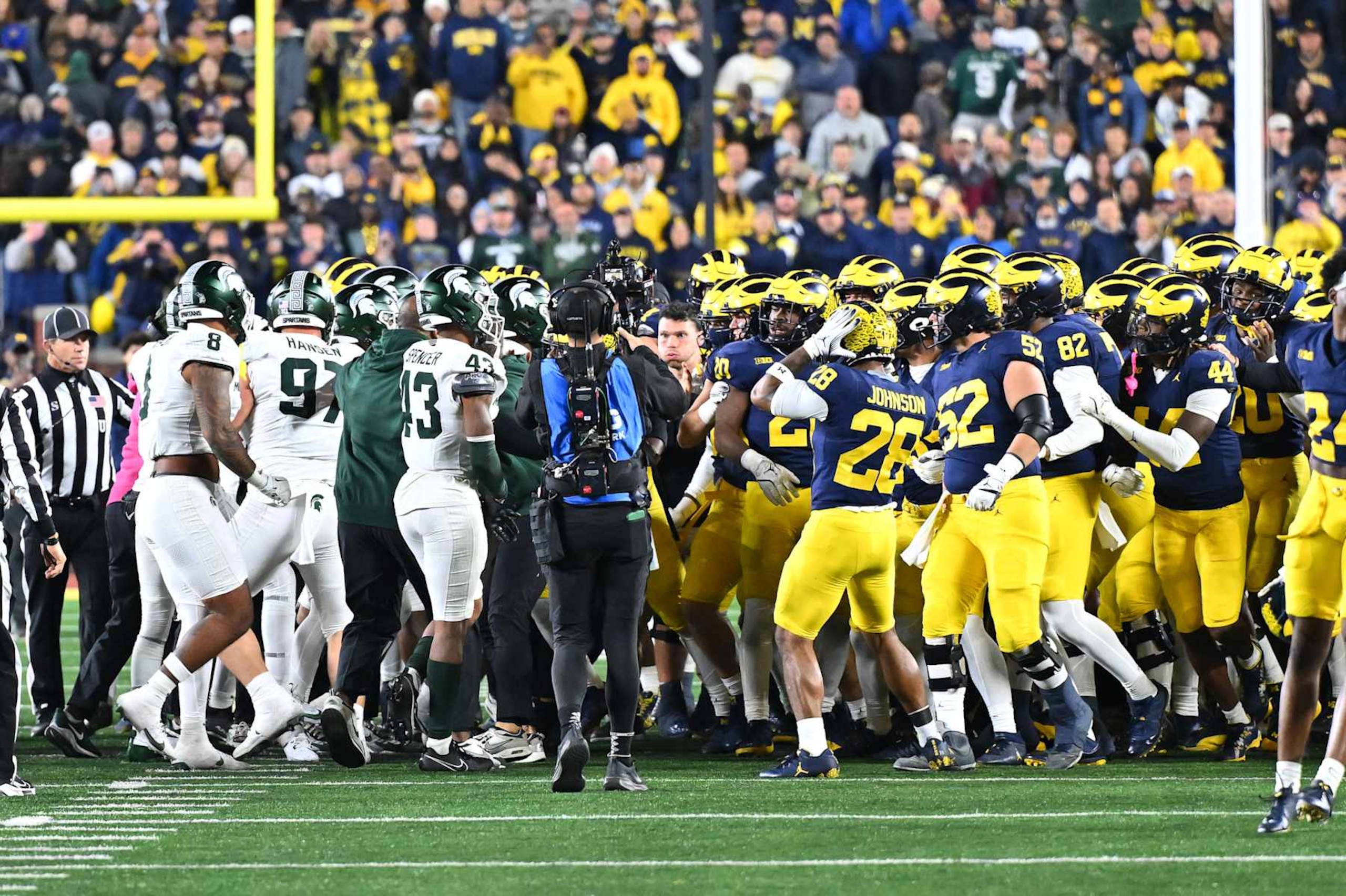 ANN ARBOR, MI - OCTOBER 26: The Michigan Wolverines and Michigan State Spartans come together in a fight at the end of the game during the Michigan Wolverines versus the Michigan State Spartans game on Saturday October 26, 2024 at Michigan Stadium in Ann Arbor, MI. (Photo by Steven King/Icon Sportswire via Getty Images) ANN ARBOR, MI - OCTOBER 26: The Michigan Wolverines and Michigan State Spartans come together in a fight at the end of the game during the Michigan Wolverines versus the Michigan State Spartans game on Saturday October 26, 2024 at Michigan Stadium in Ann Arbor, MI. (Photo by Steven King/Icon Sportswire via Getty Images)