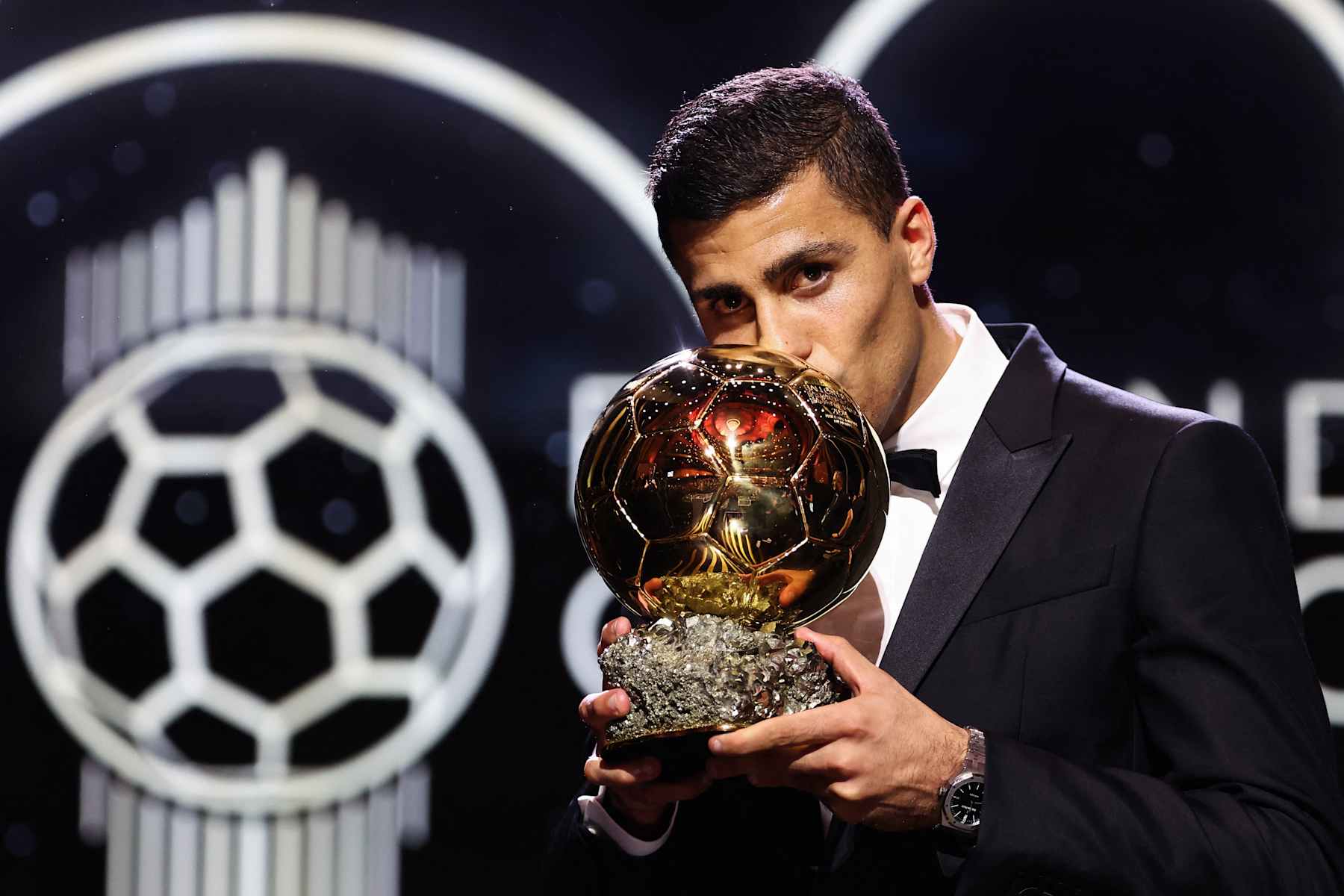 Manchester City's Spanish midfielder Rodri kisses the trophy as he receives the Ballon d'Or award during the 2024 Ballon d'Or France Football award ceremony at the Theatre du Chatelet in Paris on October 28, 2024. (Photo by FRANCK FIFE / AFP) (Photo by FRANCK FIFE/AFP via Getty Images)