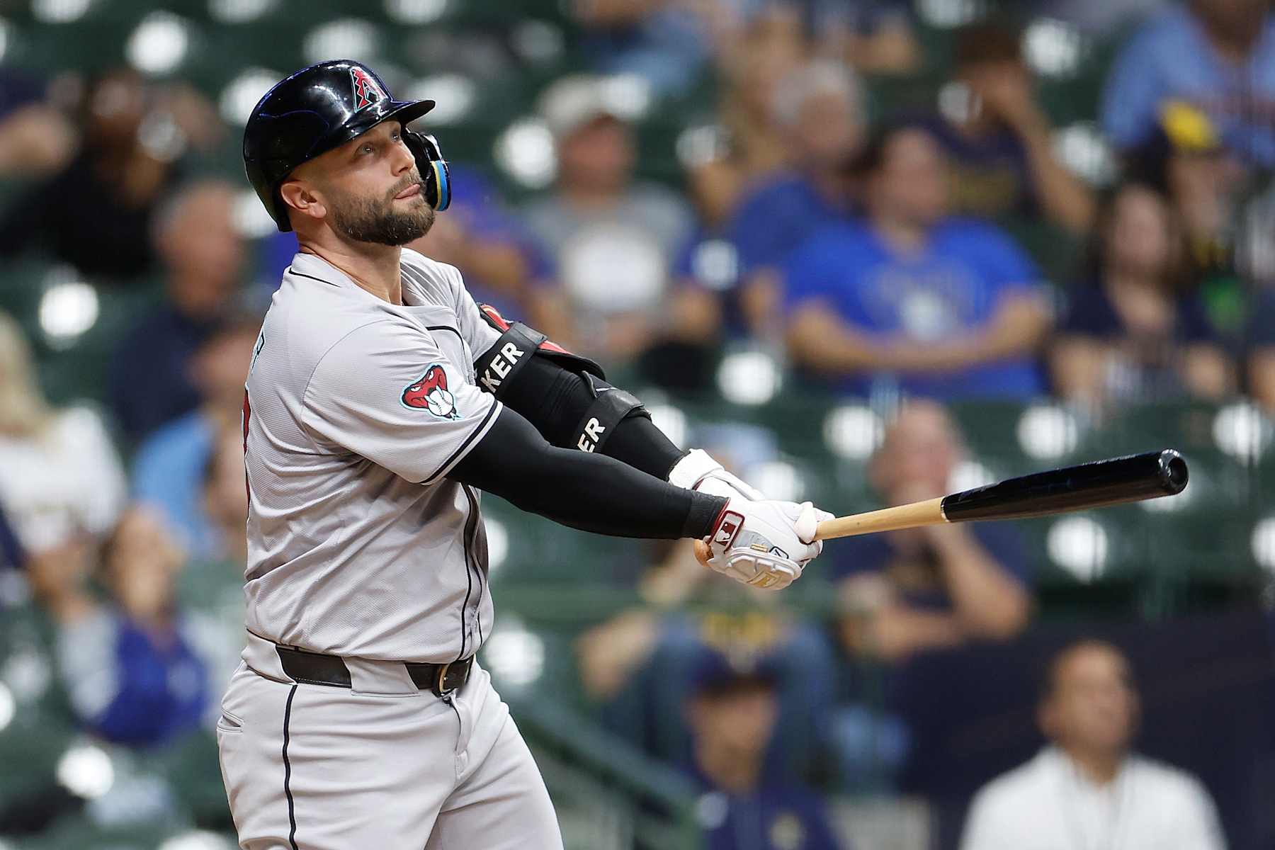 MILWAUKEE, WISCONSIN - SEPTEMBER 19: Christian Walker #53 of the Arizona Diamondbacks hits a sacrifice fly to score a run in the fifth inning against the Milwaukee Brewers at American Family Field on September 19, 2024 in Milwaukee, Wisconsin. (Photo by John Fisher/Getty Images)