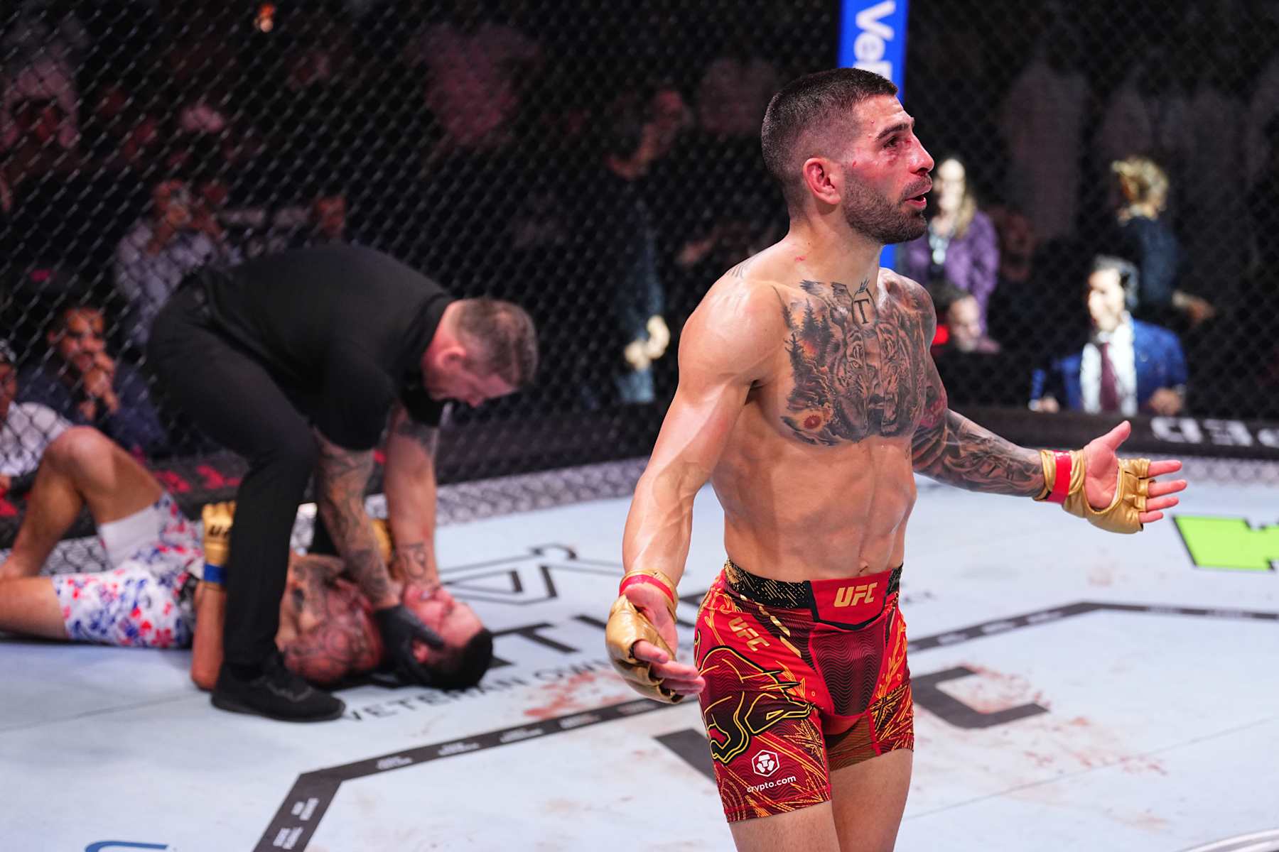 Ilia Topuria reacts after a knockout victory against Max Holloway