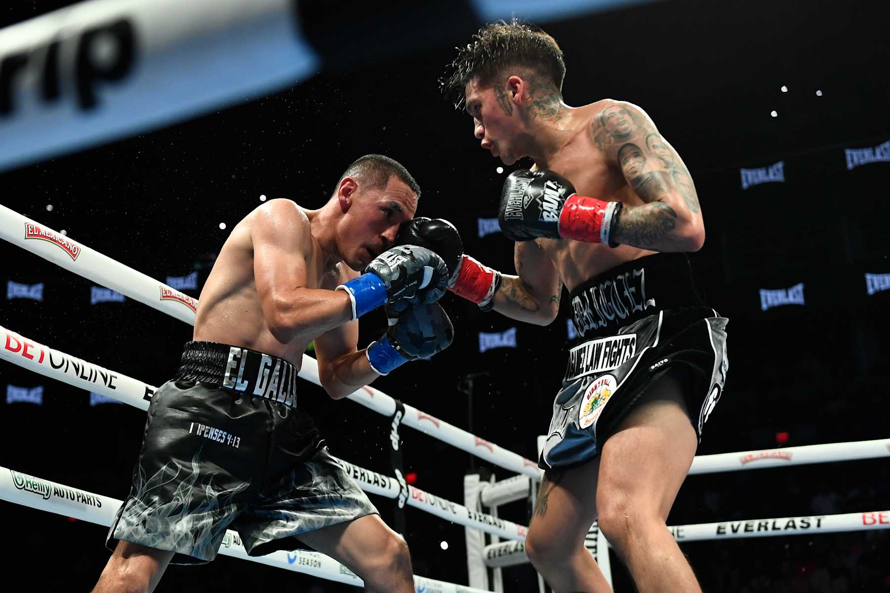 PHOENIX, ARIZONA - JUNE 29: Jesse ‘Bam’ Rodriguez (R) of the United States throws a right on Juan Francisco Estrada (L) of Mexico during their WBC world and Ring Magazine super flyweight title bout at Footprint Center on June 29, 2024 in Phoenix, Arizona. (Photo by Kelsey Grant/Getty Images)