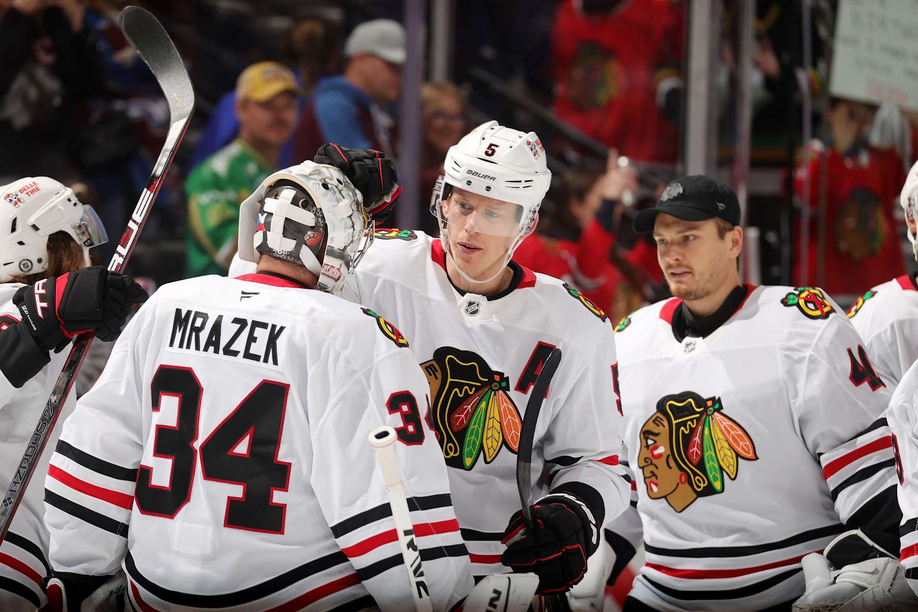 DENVER, COLORADO - OCTOBER 28: Goaltender Petr Mrazek #34 and Connor Murphy #5 of the Chicago Blackhawks celebrate a win against the Colorado Avalanche at Ball Arena on October 28, 2024 in Denver, Colorado. (Photo by Michael Martin/NHLI via Getty Images)