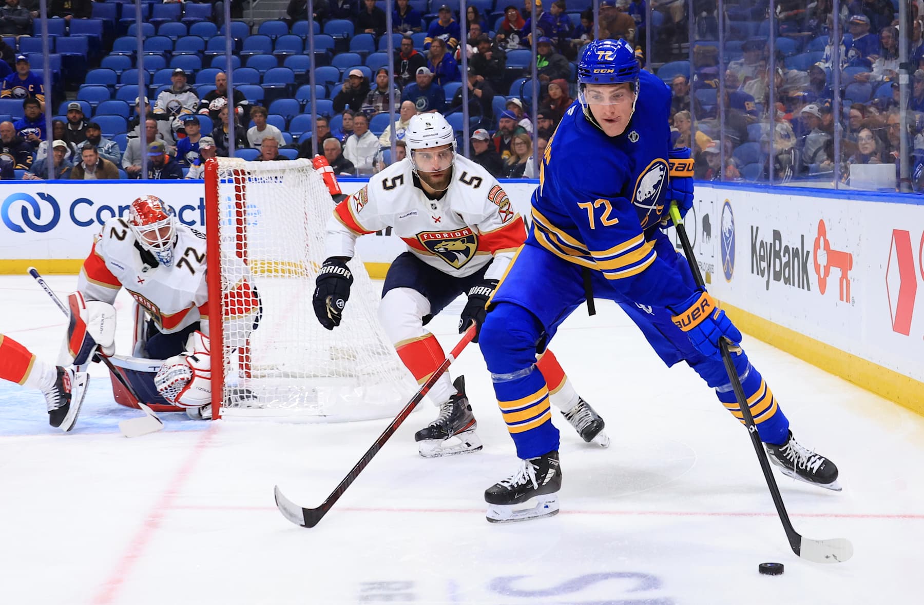 BUFFALO, NEW YORK - OCTOBER 28: Tage Thompson #72 of the Buffalo Sabres controls the puck as Aaron Ekblad #5 and Sergei Bobrovsky #72 of the Florida Panthers defend during an NHL game on October 28, 2024 at KeyBank Center in Buffalo, New York. (Photo by Bill Wippert/NHLI via Getty Images)