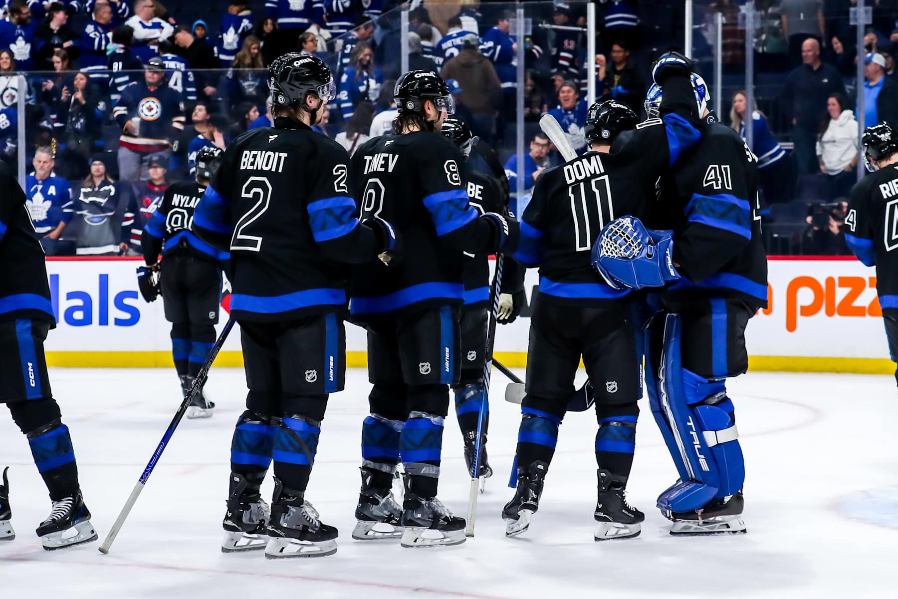 WINNIPEG, CANADA - OCTOBER 28: Toronto Maple Leafs players celebrate on the ice following a 6-4 victory over the Winnipeg Jets at the Canada Life Centre on October 28, 2024 in Winnipeg, Manitoba, Canada. (Photo by Darcy Finley/NHLI via Getty Images)