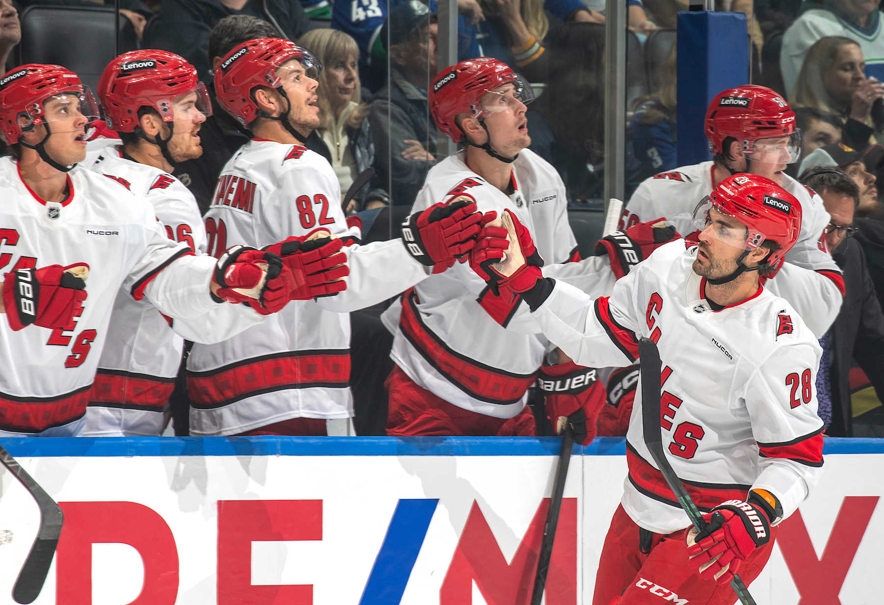 VANCOUVER, CANADA - OCTOBER 28: William Carrier #28 of the Carolina Hurricanes celebrates his goal with teammates during the first period of their NHL game against the Vancouver Canucks at Rogers Arena on October 28, 2024 in Vancouver, British Columbia, Canada. (Photo by Jeff Vinnick/NHLI via Getty Images)