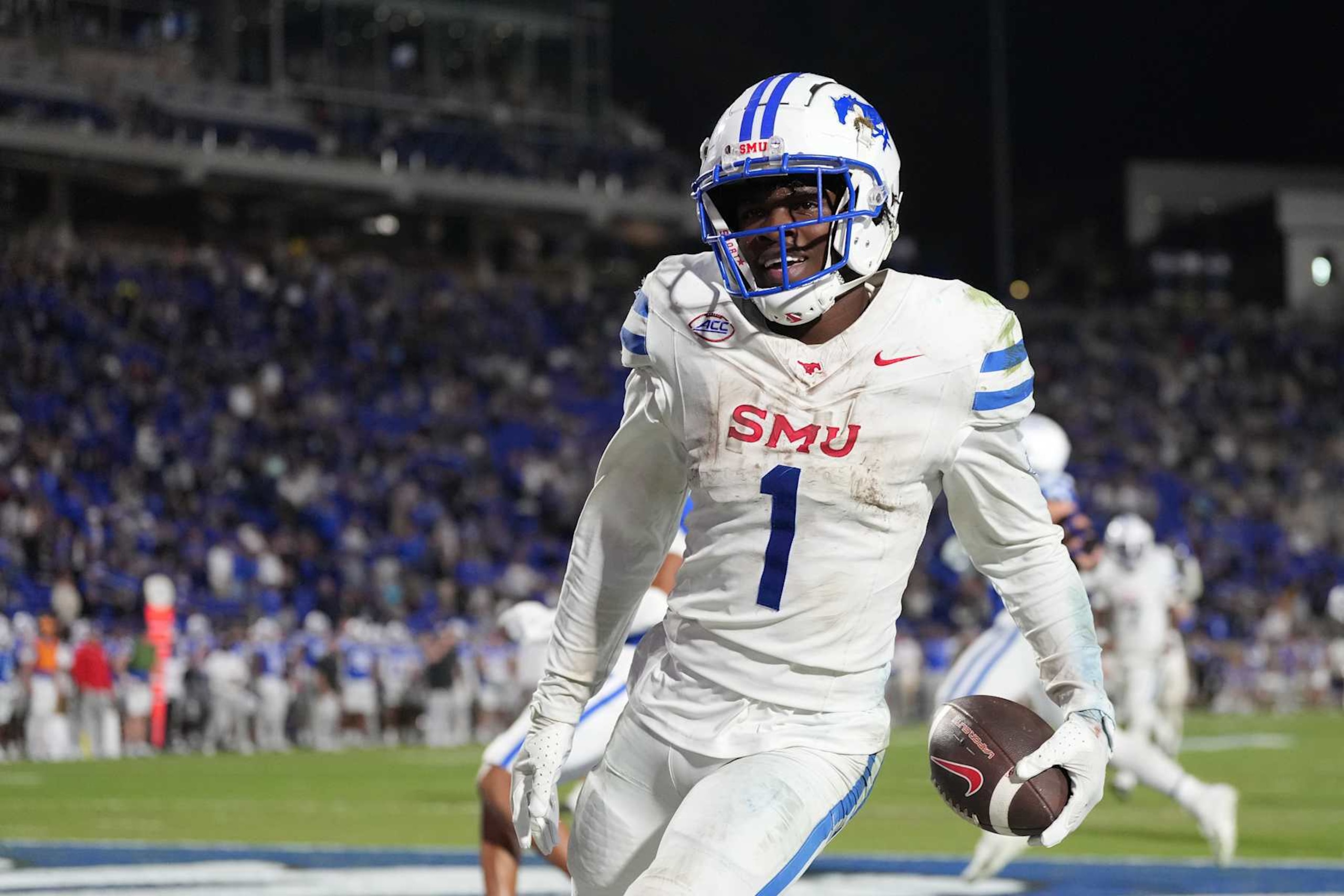 DURHAM, NORTH CAROLINA - OCTOBER 26: Brashard Smith #1 of the Southern Methodist Mustangs runs for a touchdown in overtime against the Duke Blue Devils during the game at Wallace Wade Stadium on October 26, 2024 in Durham, North Carolina. The Mustangs won 28-27 in overtime. (Photo by Grant Halverson/Getty Images) DURHAM, NORTH CAROLINA - OCTOBER 26: Brashard Smith #1 of the Southern Methodist Mustangs runs for a touchdown in overtime against the Duke Blue Devils during the game at Wallace Wade Stadium on October 26, 2024 in Durham, North Carolina. The Mustangs won 28-27 in overtime. (Photo by Grant Halverson/Getty Images)