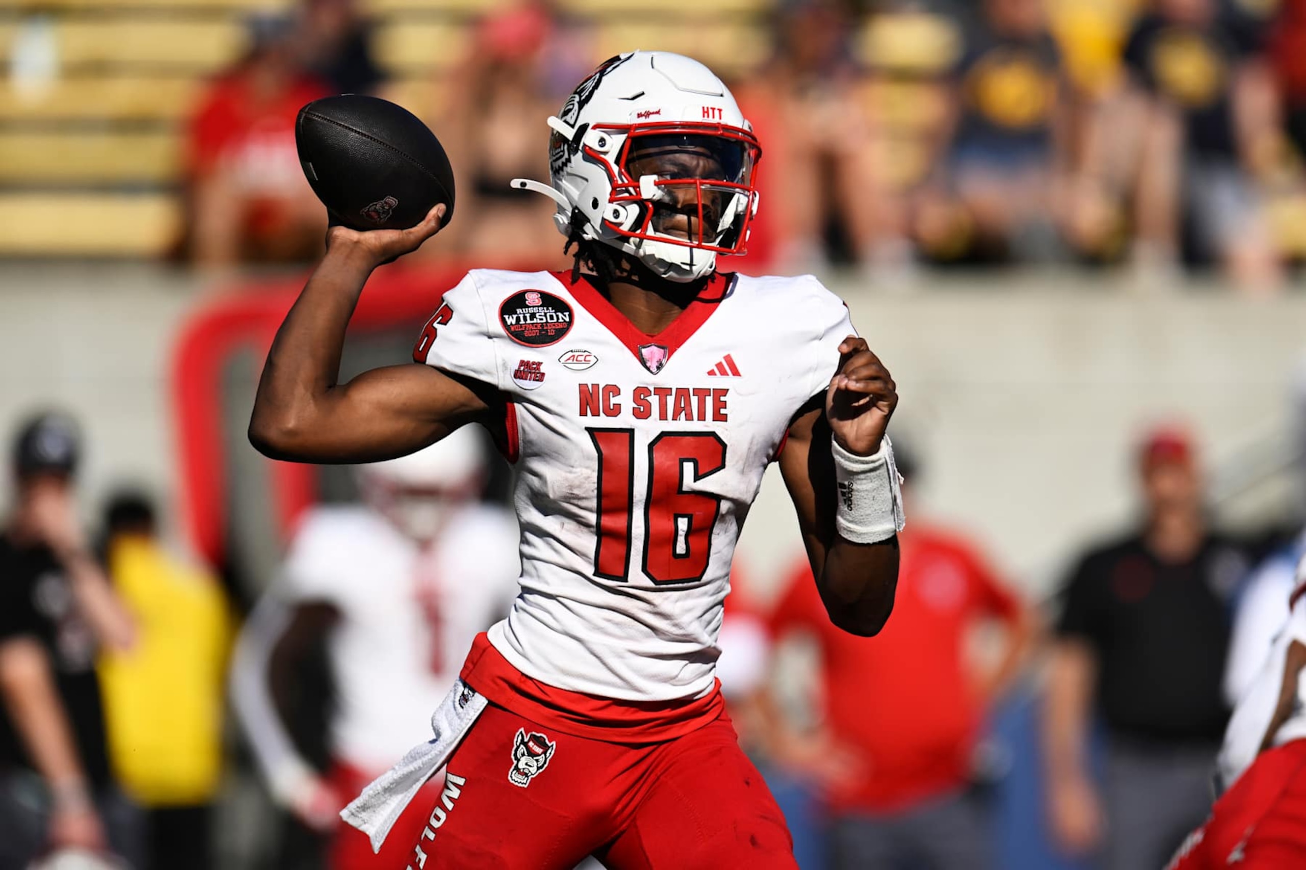 BERKELEY, CALIFORNIA - OCTOBER 19: CJ Bailey #16 of the North Carolina State Wolfpack throws against the California Golden Bears fourth quarter at California Memorial Stadium on October 19, 2024 in Berkeley, California. (Photo by Eakin Howard/Getty Images) BERKELEY, CALIFORNIA - OCTOBER 19: CJ Bailey #16 of the North Carolina State Wolfpack throws against the California Golden Bears fourth quarter at California Memorial Stadium on October 19, 2024 in Berkeley, California. (Photo by Eakin Howard/Getty Images)