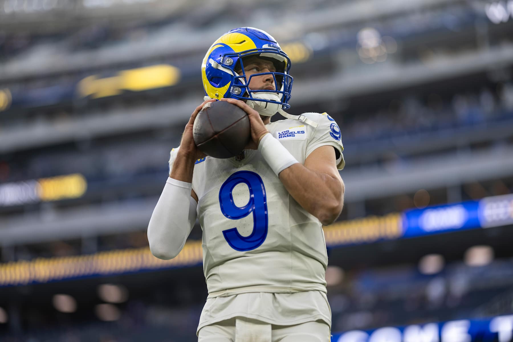 INGLEWOOD, CALIFORNIA - OCTOBER 24: Matthew Stafford #9 of the Los Angeles looks to pass as he warms up during an NFL Football game against the Minnesota Vikings at SoFi Stadium on October 24, 2024 in Inglewood, California. (Photo by Michael Owens/Getty Images)