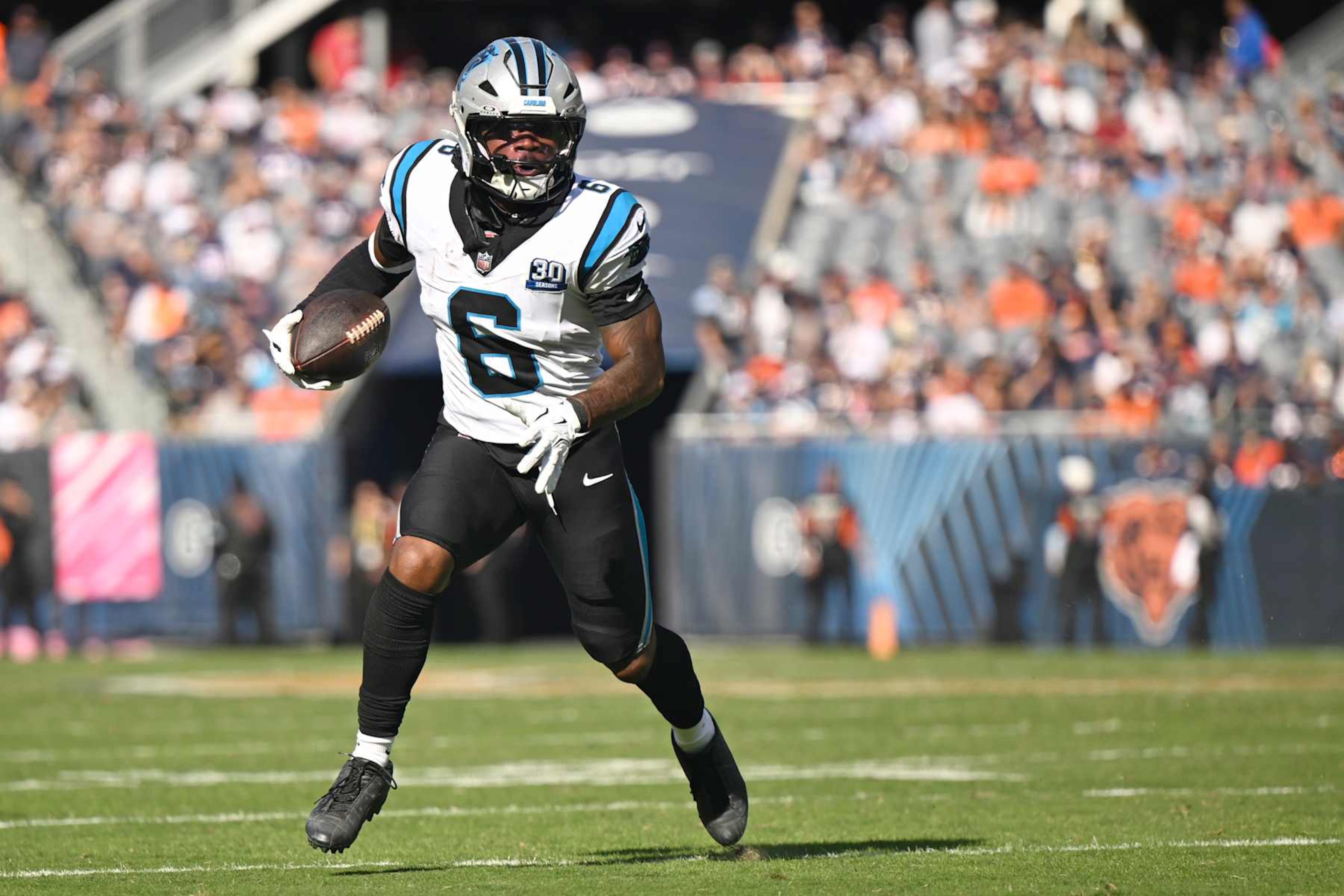 CHICAGO, ILLINOIS - OCTOBER 06: Miles Sanders #6 of the Carolina Panthers runs with the ball against the Chicago Bears during the fourth quarter at Soldier Field on October 06, 2024 in Chicago, Illinois. (Photo by Quinn Harris/Getty Images) CHICAGO, ILLINOIS - OCTOBER 06: Miles Sanders #6 of the Carolina Panthers runs with the ball against the Chicago Bears during the fourth quarter at Soldier Field on October 06, 2024 in Chicago, Illinois. (Photo by Quinn Harris/Getty Images)