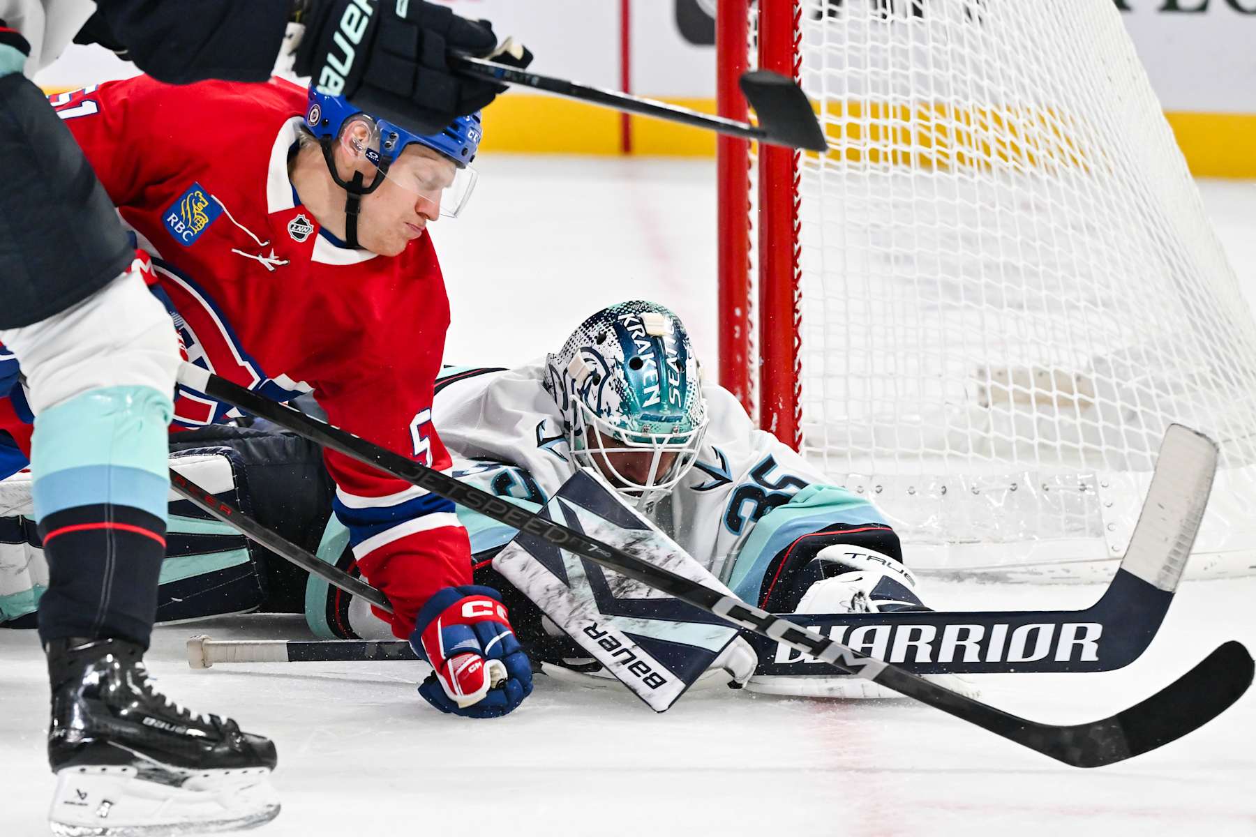MONTREAL, CANADA - OCTOBER 29: Goaltender Joey Daccord #35 of the Seattle Kraken covers the puck during the second period against the Montreal Canadiens at the Bell Centre on October 29, 2024 in Montreal, Quebec, Canada. (Photo by Minas Panagiotakis/Getty Images)