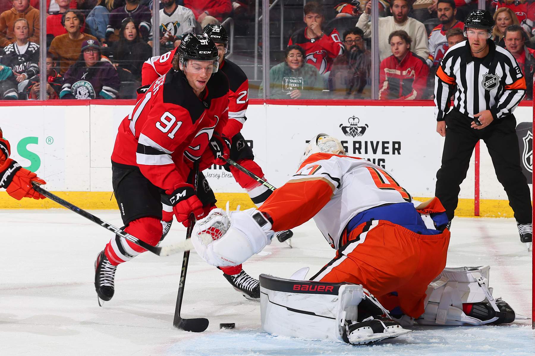 NEWARK, NJ - OCTOBER 27: Dawson Mercer #91 of the New Jersey Devils skates in the first period of the game against the Anaheim Ducks at the Prudential Center on October 27, 2024 in Newark, New Jersey. (Photo by Rich Graessle/NHLI via Getty Images)