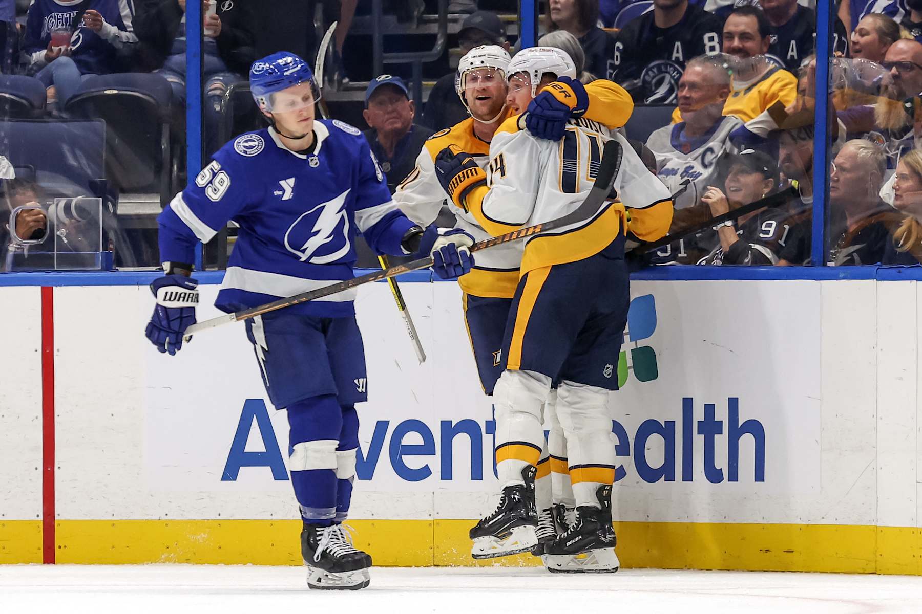 TAMPA, FL - OCTOBER 28: Steven Stamkos #91 of the Nashville Predators celebrates the goal of Gustav Nyquist #14 as Jake Guentzel #59 of the Tampa Bay Lightning reacts during the second period of the game at Amalie Arena on October 28, 2024 in Tampa, Florida. (Photo by Mike Carlson/Getty Images)