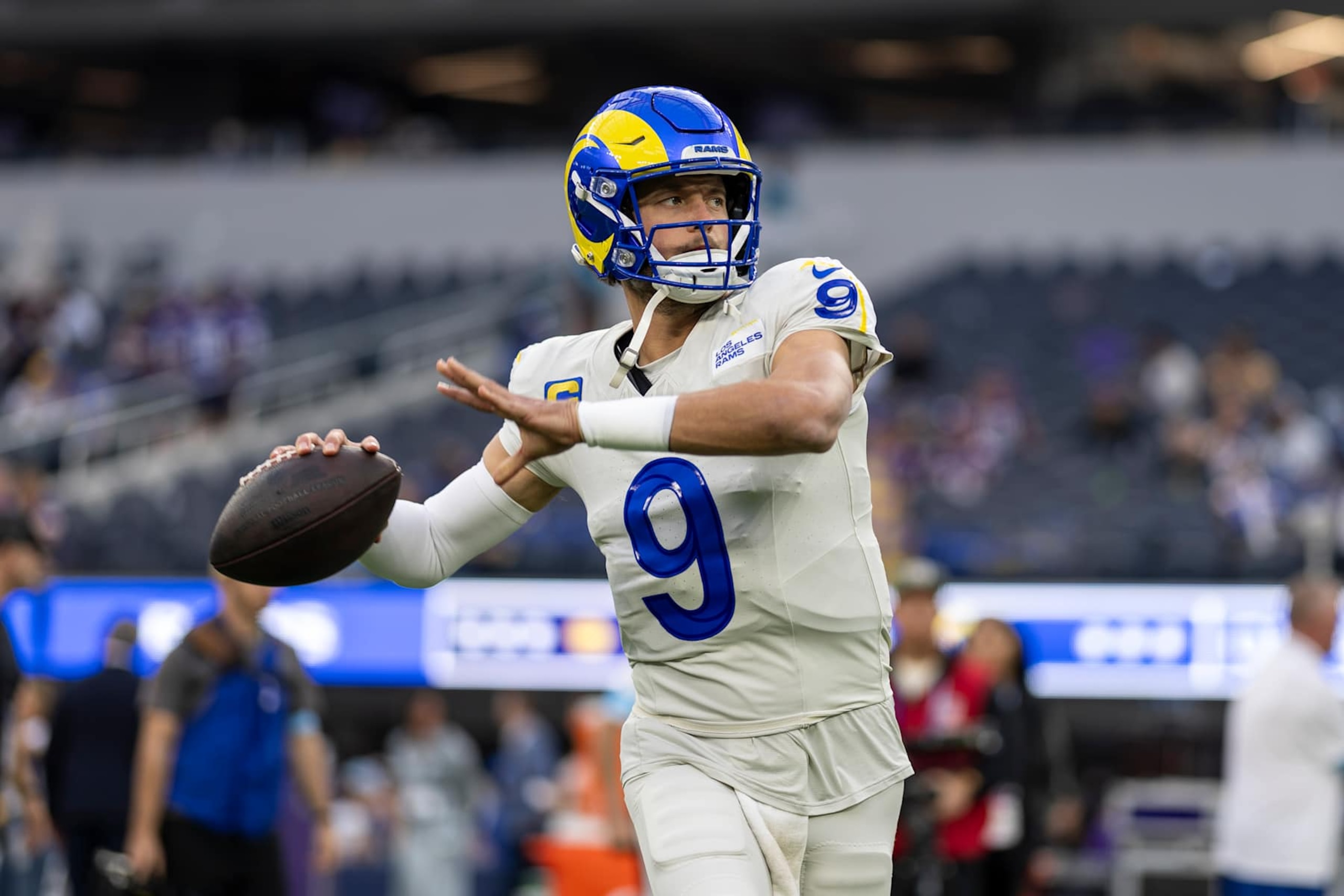 INGLEWOOD, CALIFORNIA - OCTOBER 24: Matthew Stafford #9 of the Los Angeles looks to pass as he warms up during an NFL Football game against the Minnesota Vikings at SoFi Stadium on October 24, 2024 in Inglewood, California. (Photo by Michael Owens/Getty Images)