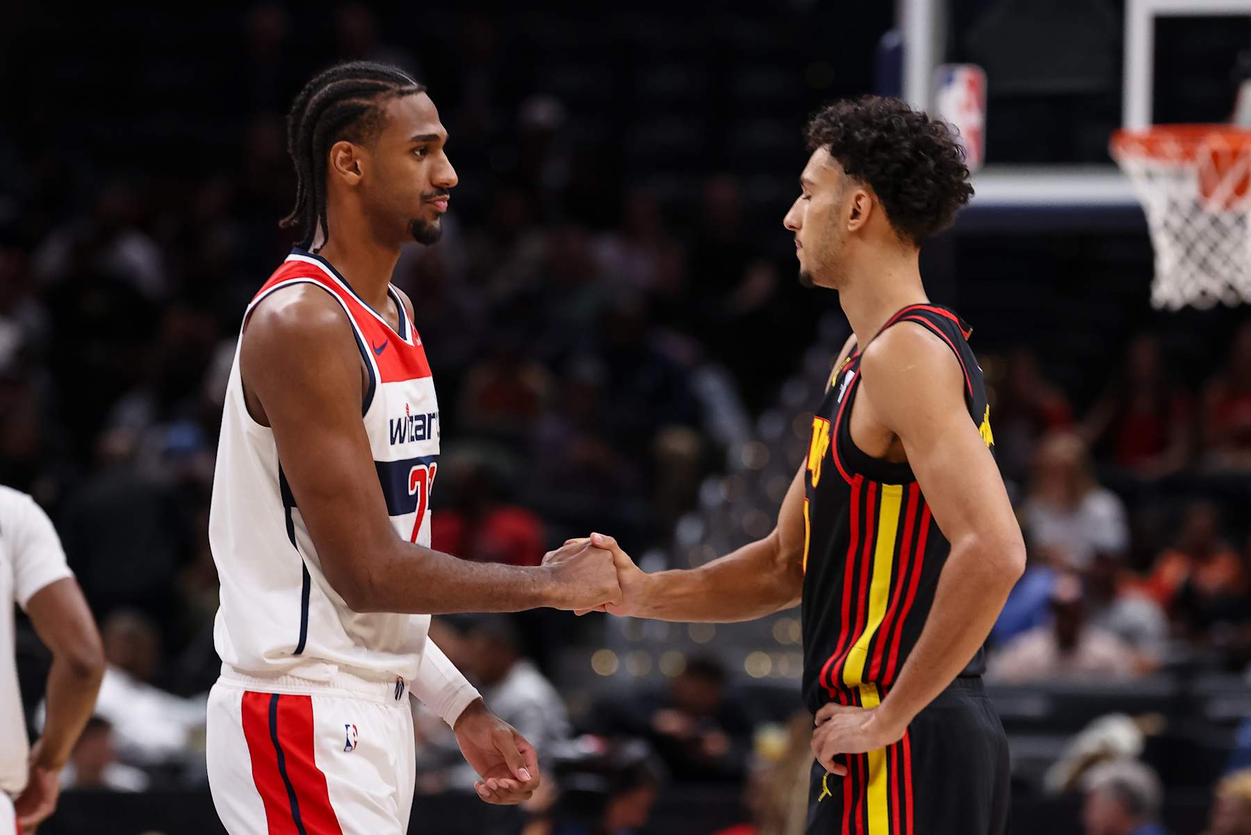 WASHINGTON, DC - OCTOBER 30: Alexandre Sarr #20 of the Washington Wizards and Zaccharie Risacher #10 of the Atlanta Hawks shake hands before the game at Capital One Arena on October 30, 2024 in Washington, DC. NOTE TO USER: User expressly acknowledges and agrees that, by downloading and or using this photograph, User is consenting to the terms and conditions of the Getty Images License Agreement. (Photo by Scott Taetsch/Getty Images)